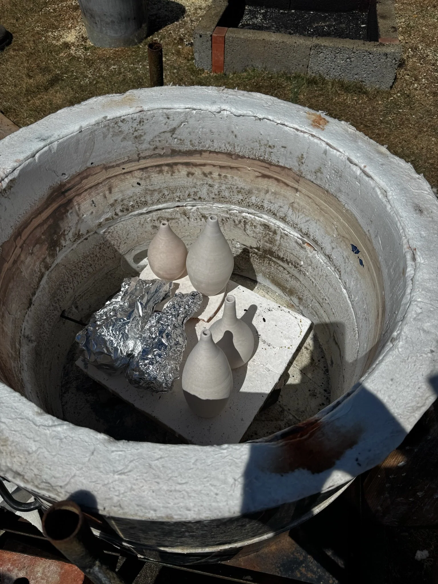 pots in raku kiln outside