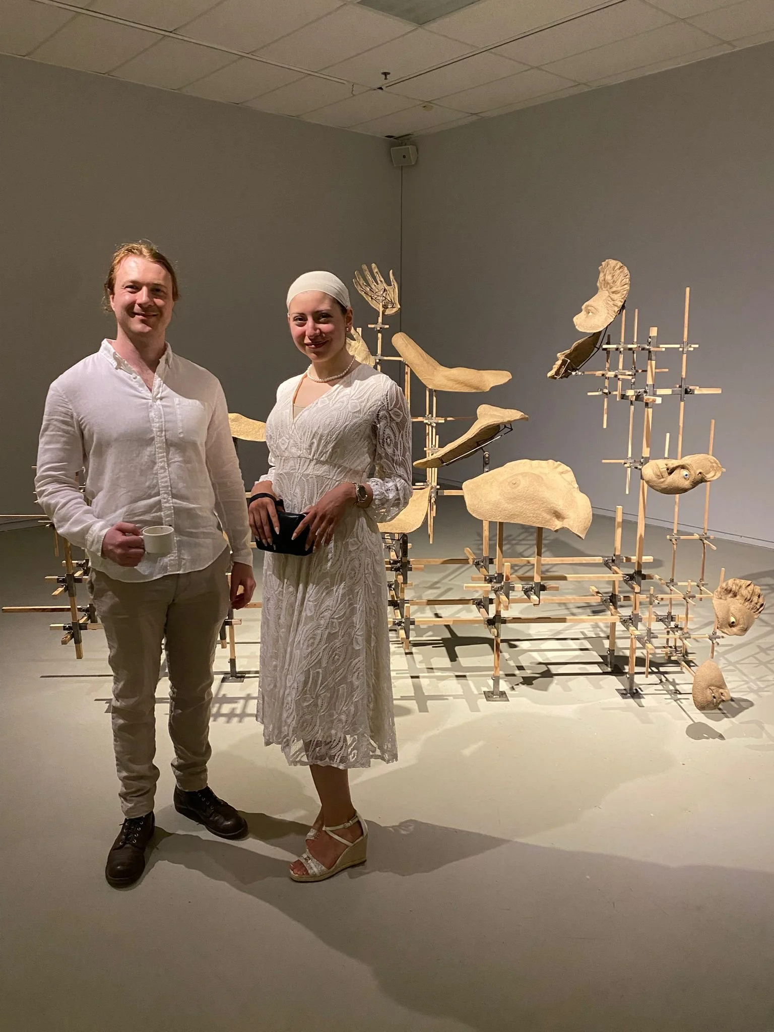 With the groundbreaking sculptor Oliver Zephyr Chardt next to the piece "Somebody" at his show at the Saint Mary's Art Gallery, Halifax, NS. (2025).