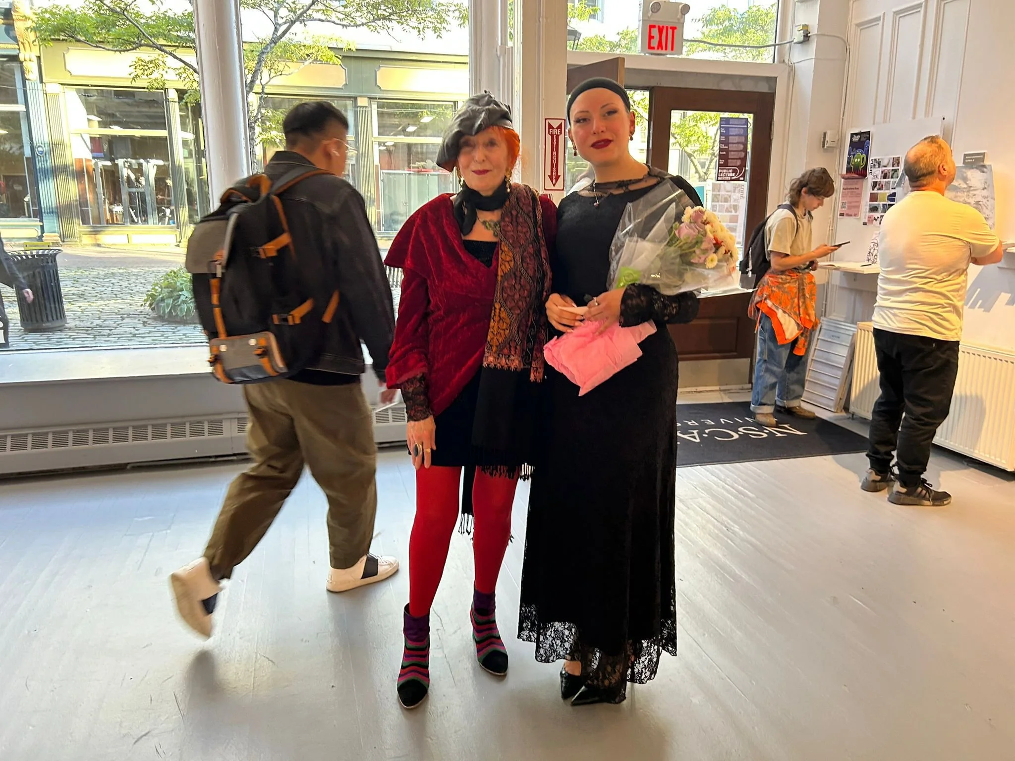 With the eclectic author and many other titles, Astrid Brunner at the artist's show at the Anna Leonowens Gallery, Halifax, NS. (2025)