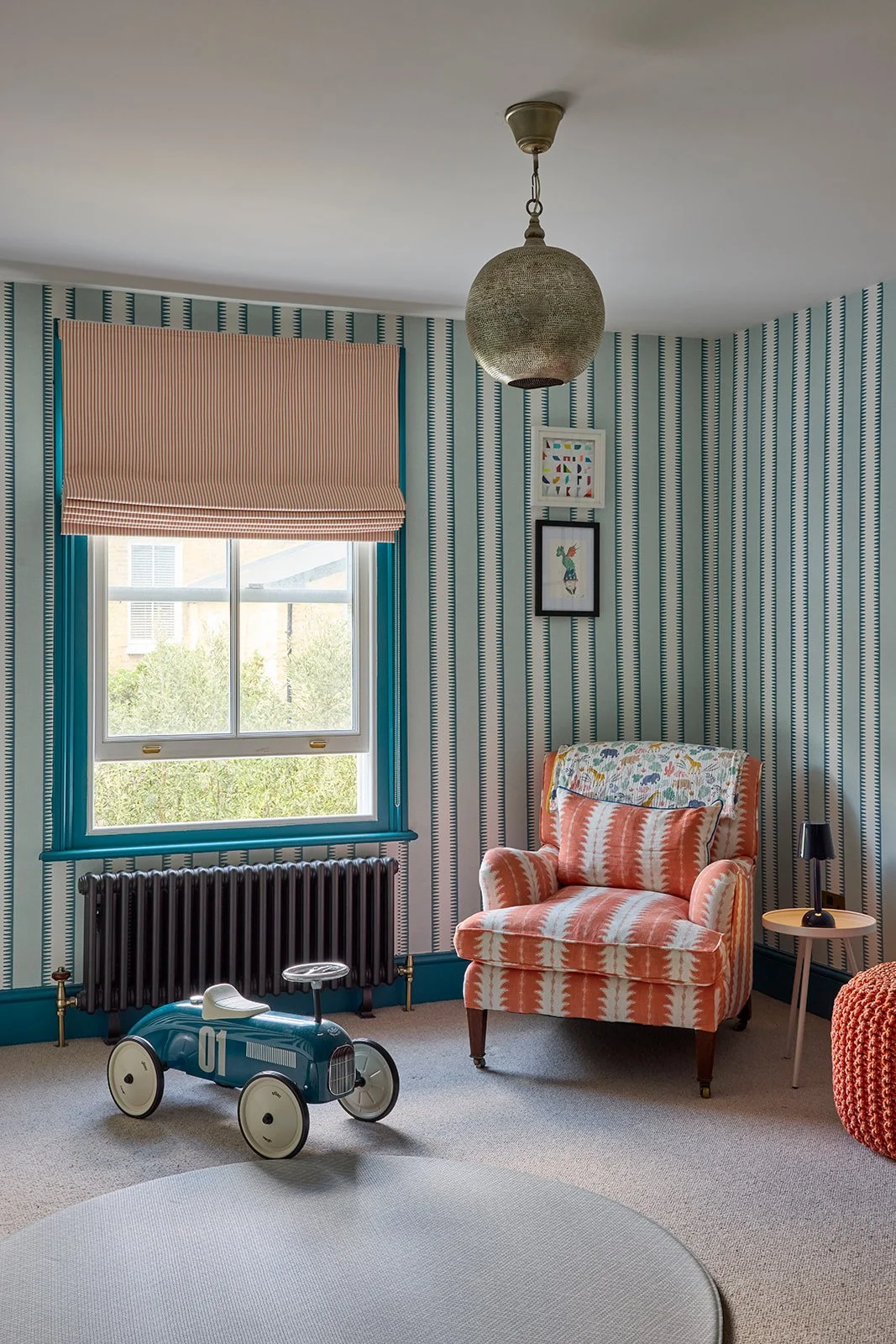 coral-blue-turqouise-nursery-stripey-wallpaper-baby-toys-armchair-plush-blinds