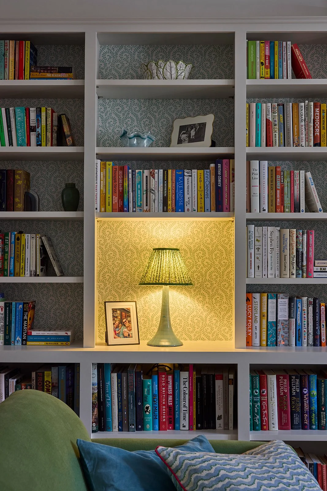 built in book shelves bookshelf funky vintage lampshade colouful lamp blue and green with patterns