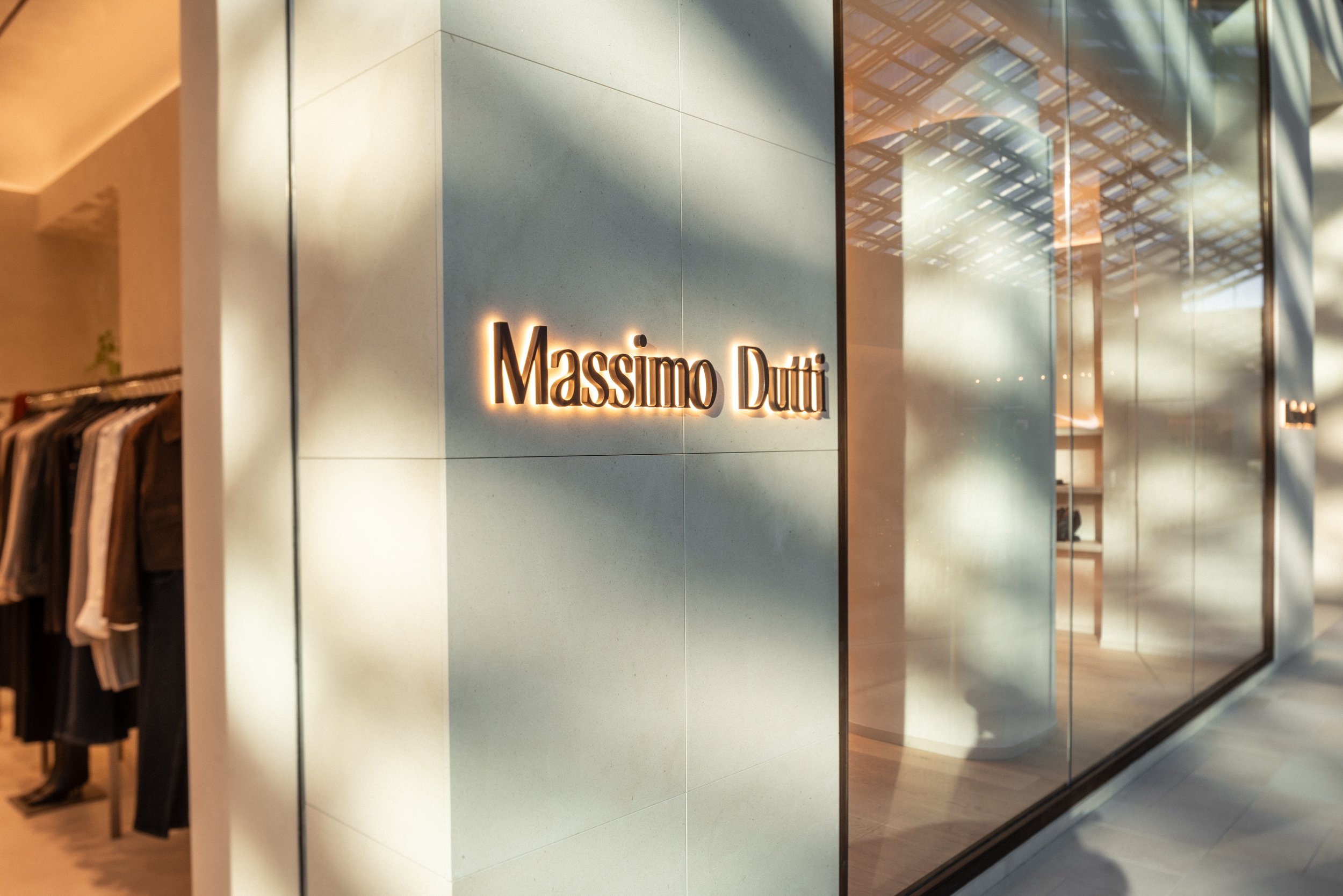 Exterior shot of Massimo Dutti store at Royalmount Montreal, emphasizing symmetry and minimalist commercial architecture, photographed by SquareLoop.