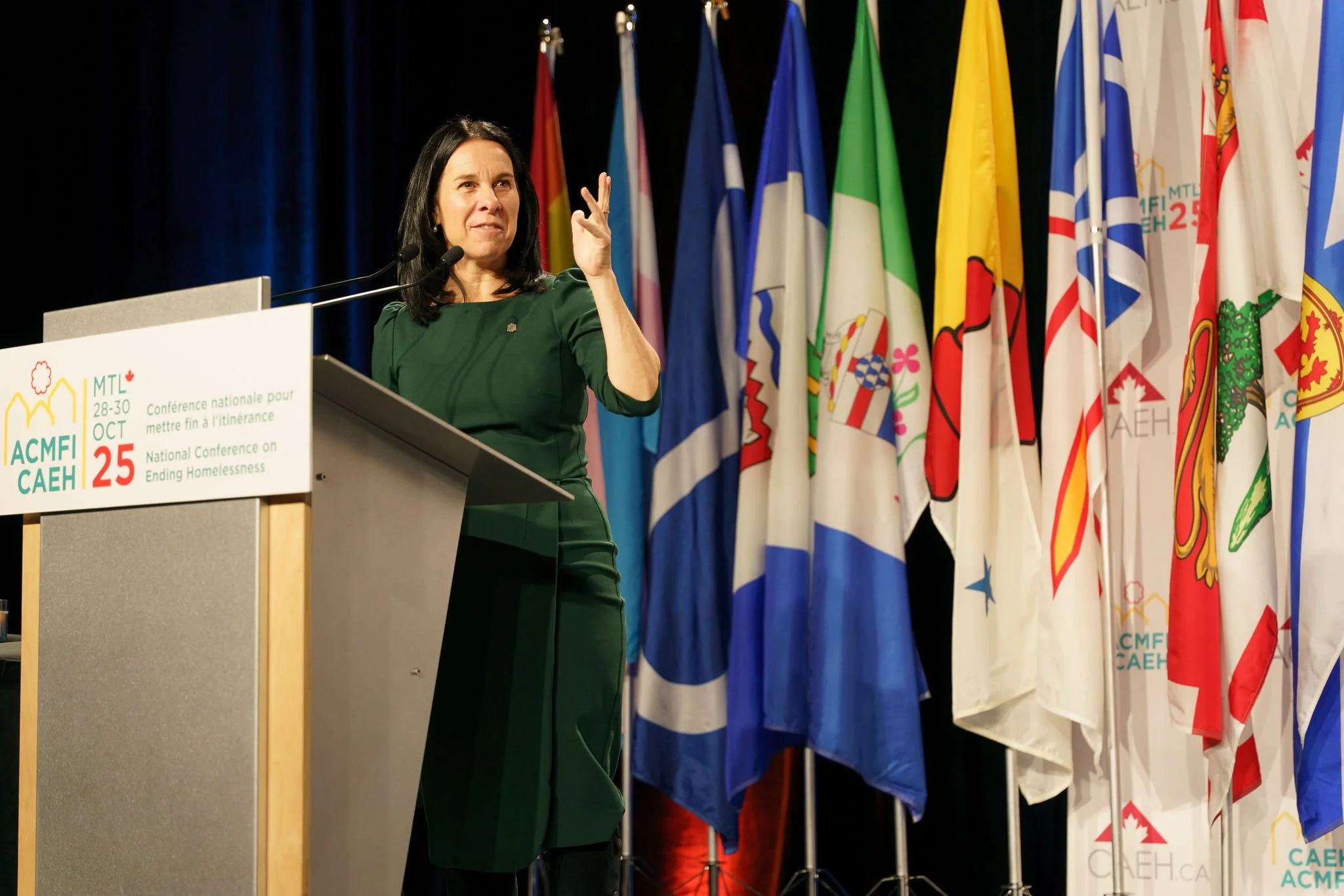 Corporate conference photography at the Palais des congrès de Montréal featuring keynote speaker Valerie Plant