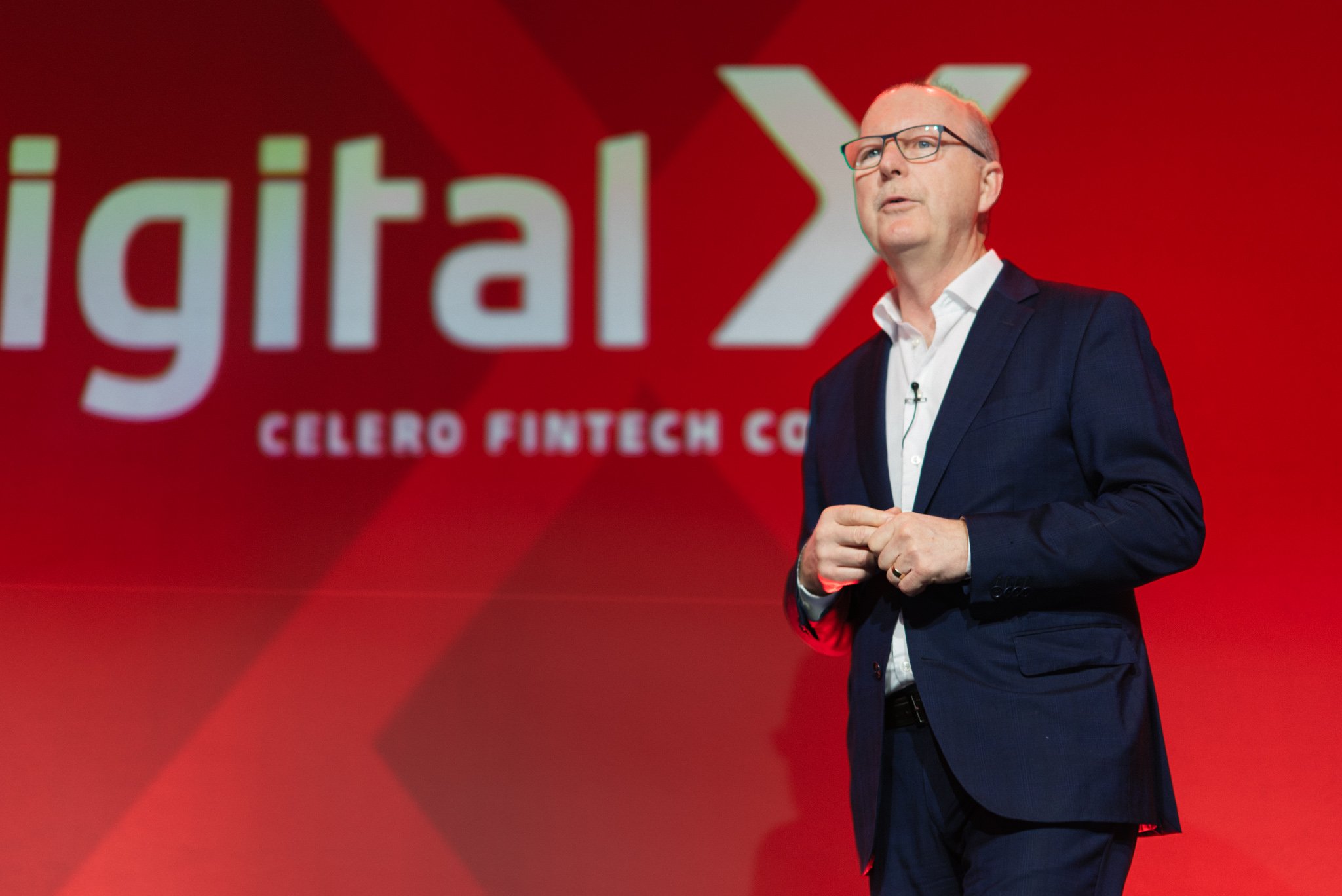 Keynote speaker on stage at the Celero Fintech Conference in Montreal, captured by SquareLoop corporate event photography.