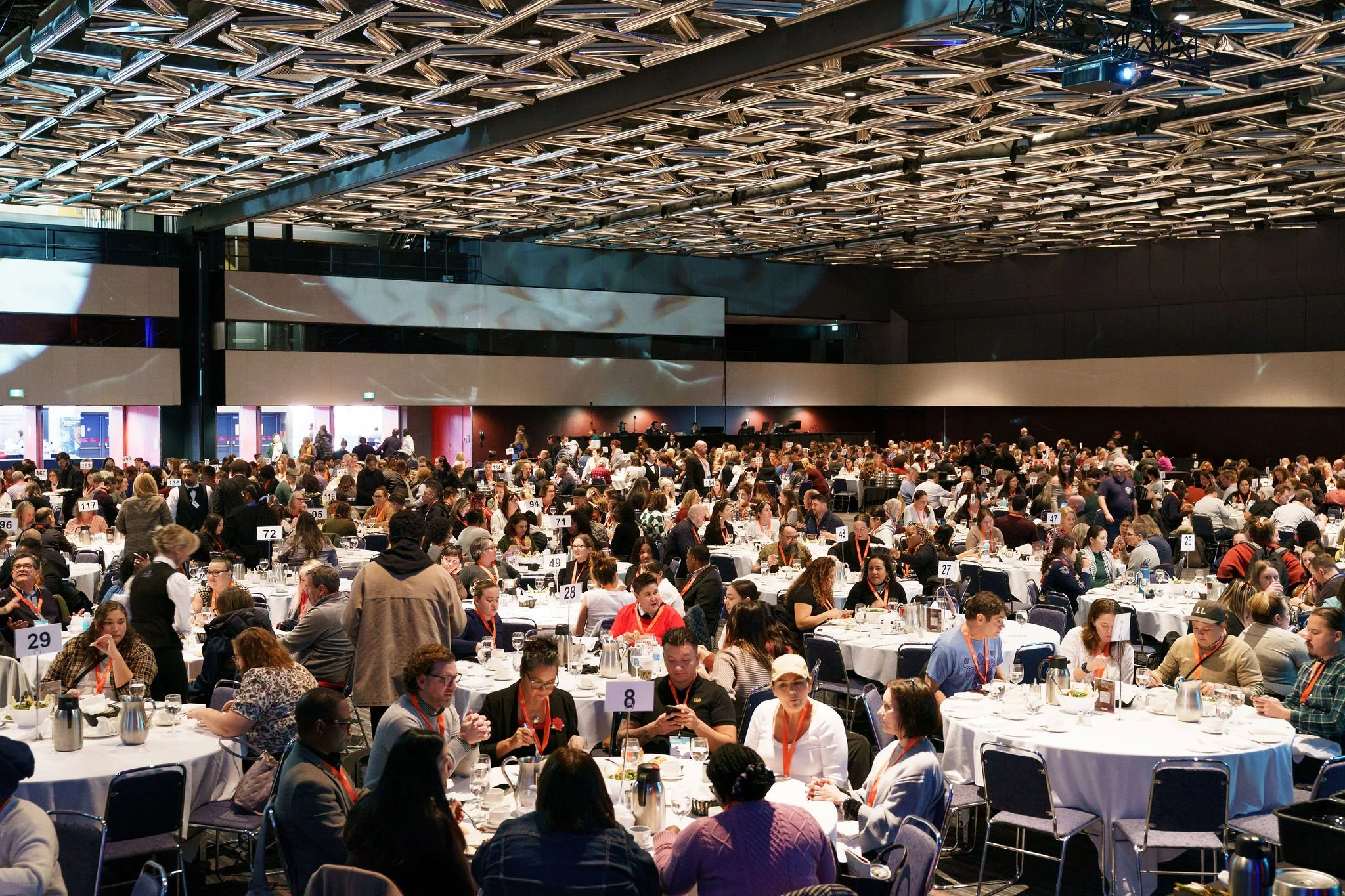 Large corporate conference event with attendees networking in Montreal