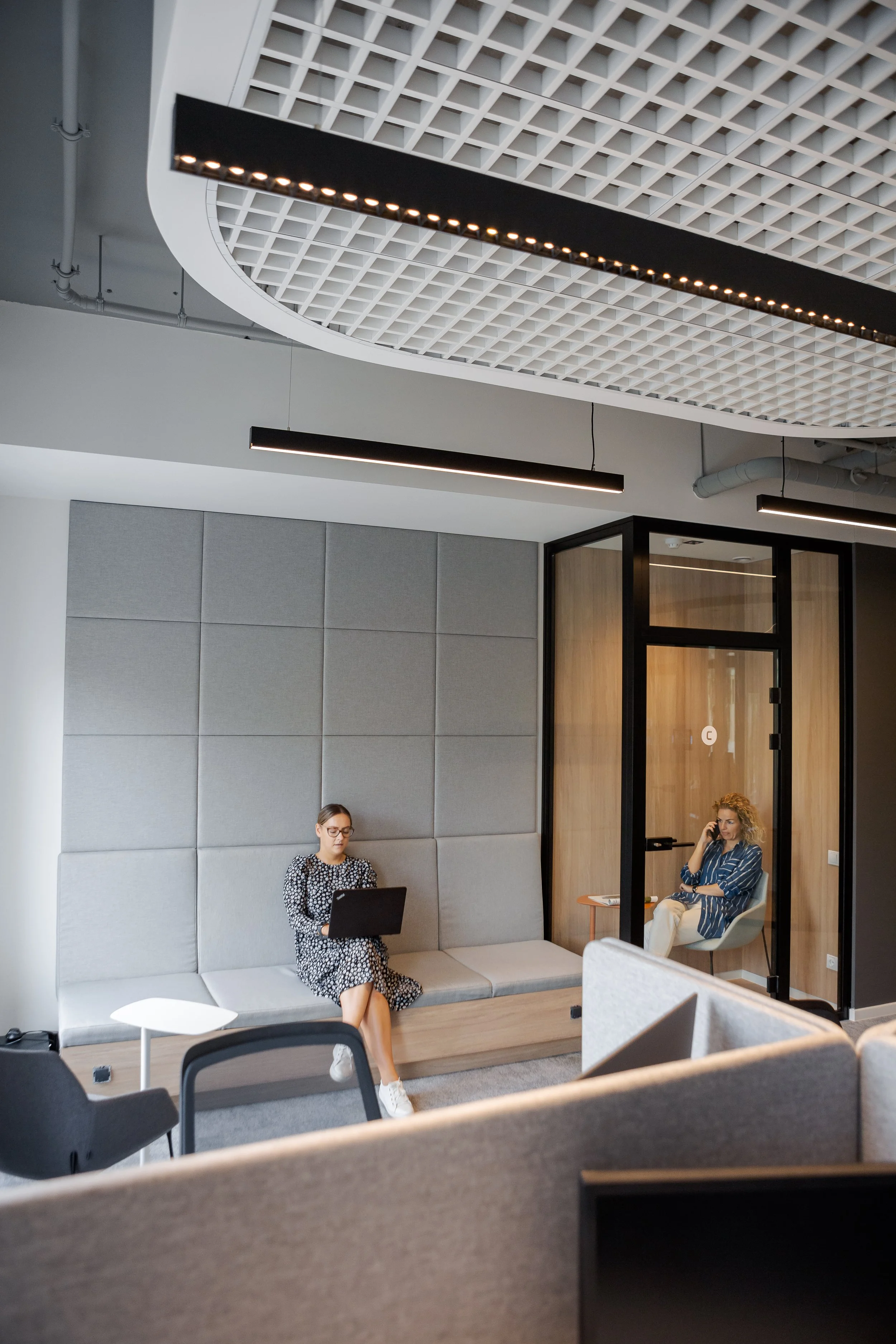 chilling zone in cozy office with acoustic fabric wall and call both
