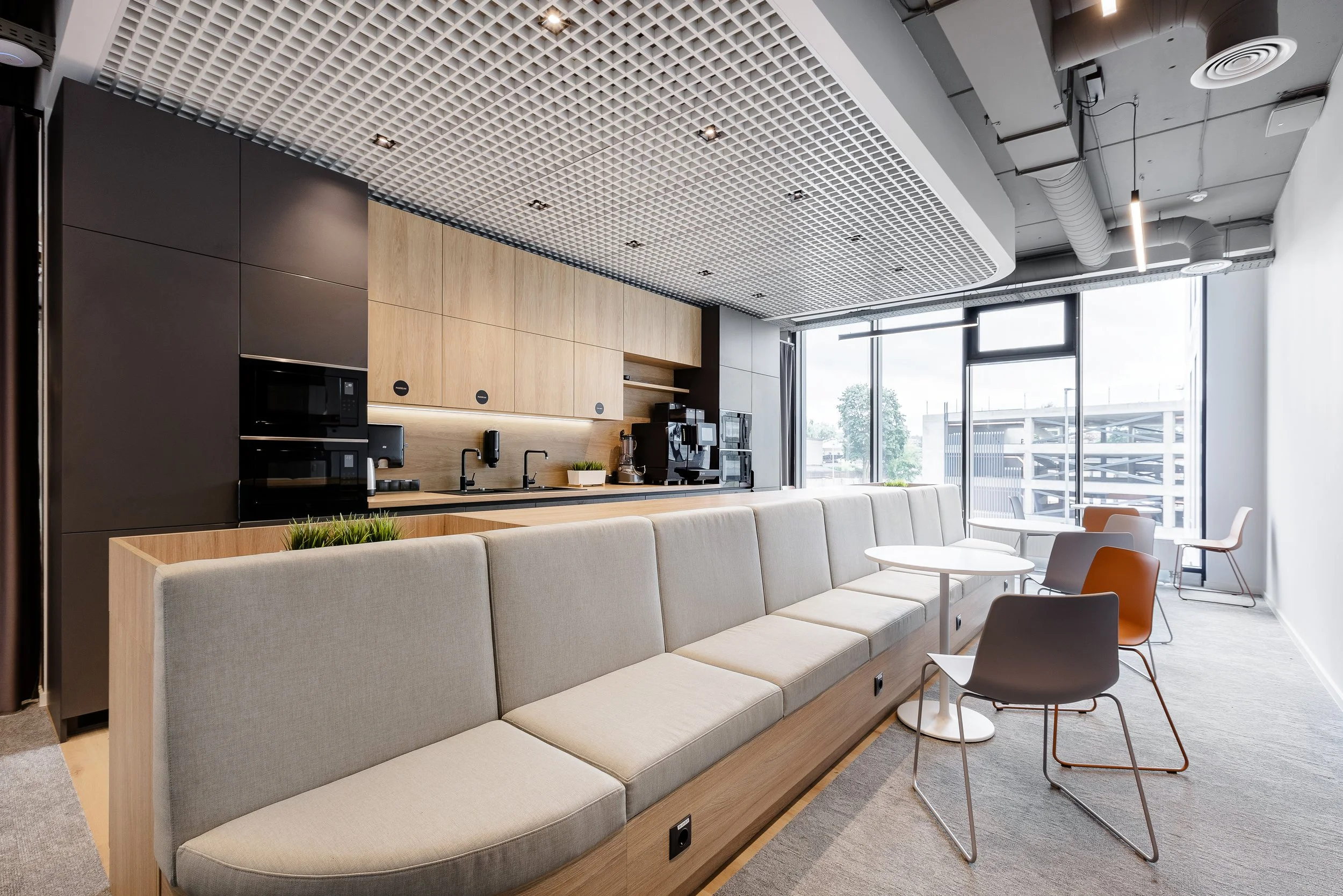 modern kitchen in office with soft seating 