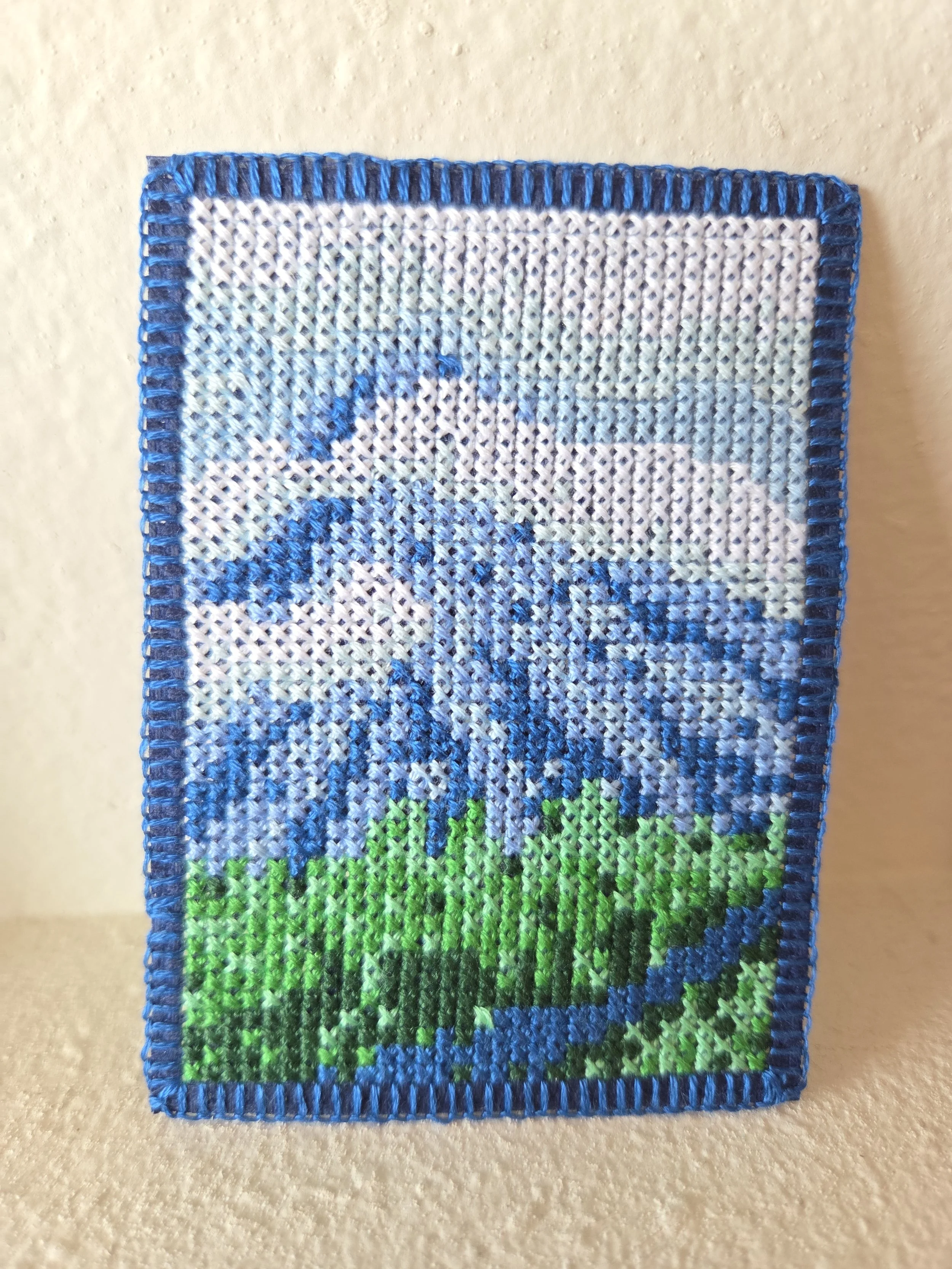 Crosstitch of a mountain landscape