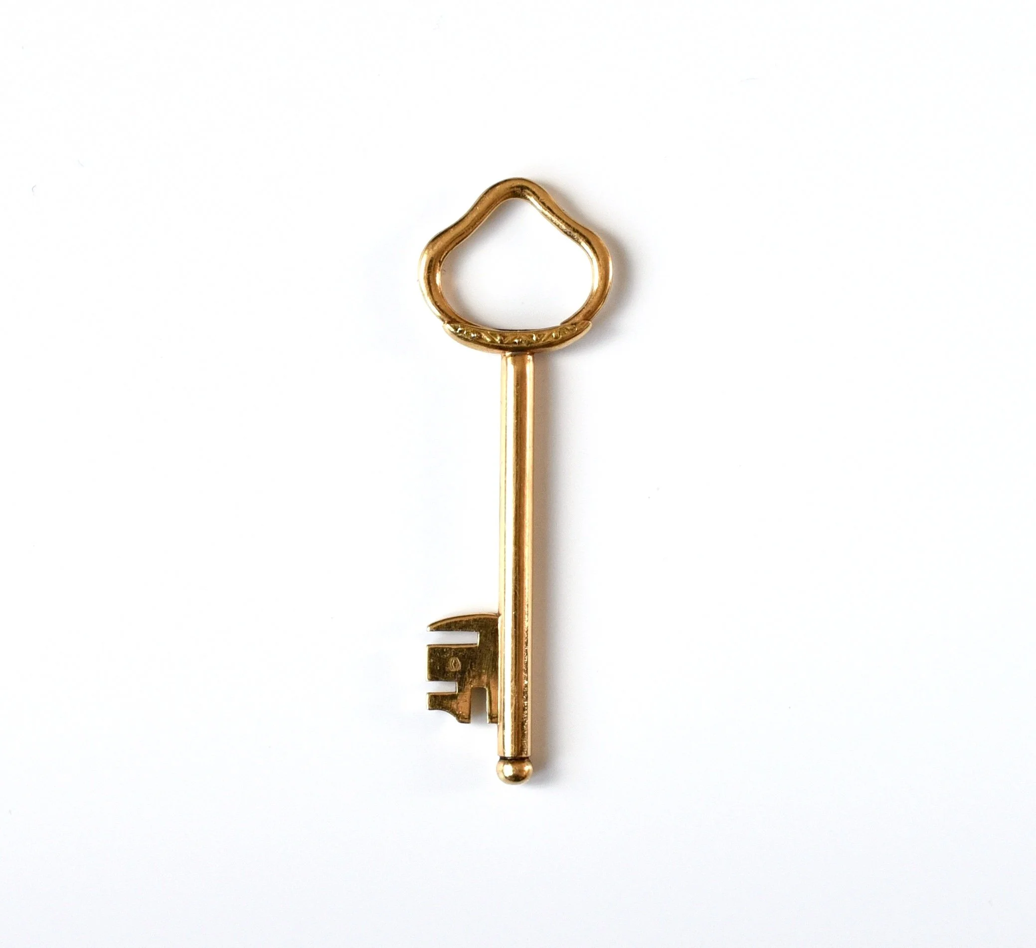 Gold key pendant