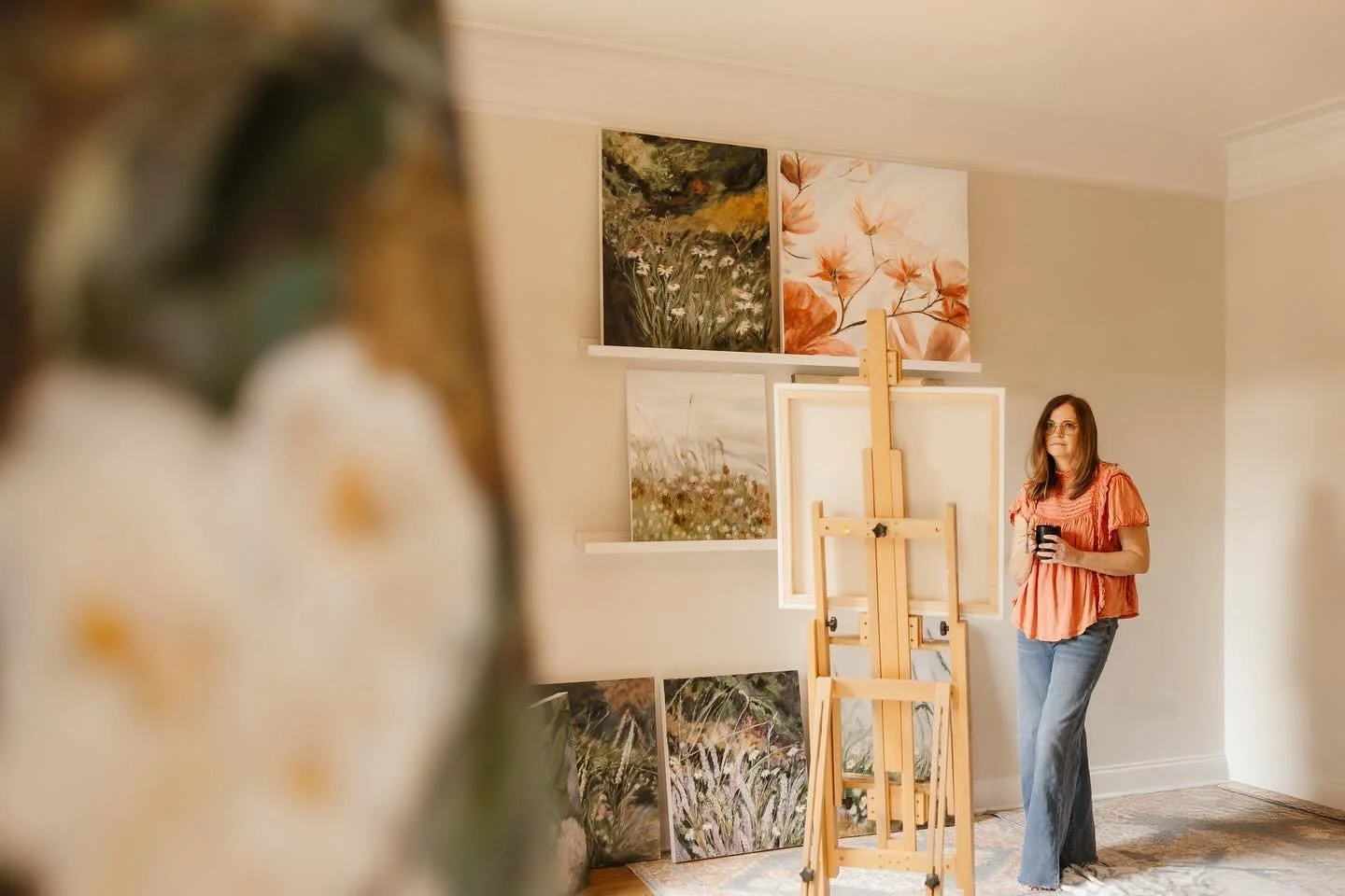 Most mornings start here, with coffee in hand and light spilling across the room. It&rsquo;s in these quiet moments that new colors, ideas, and calm begin to take shape. 📷: @luckimalloyphotography  #studiomoments #floralart #paintingjourney #moments