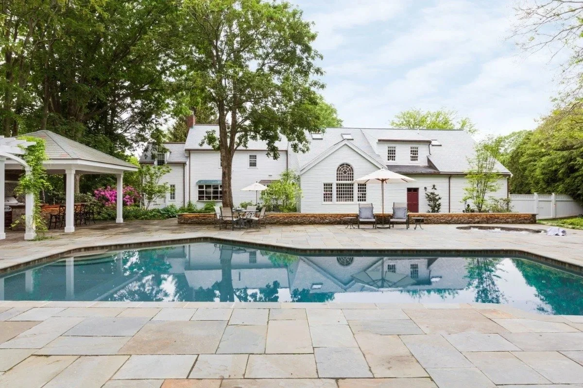 Backyard resort-style pool with bluestone patio in Cambridge, MA
