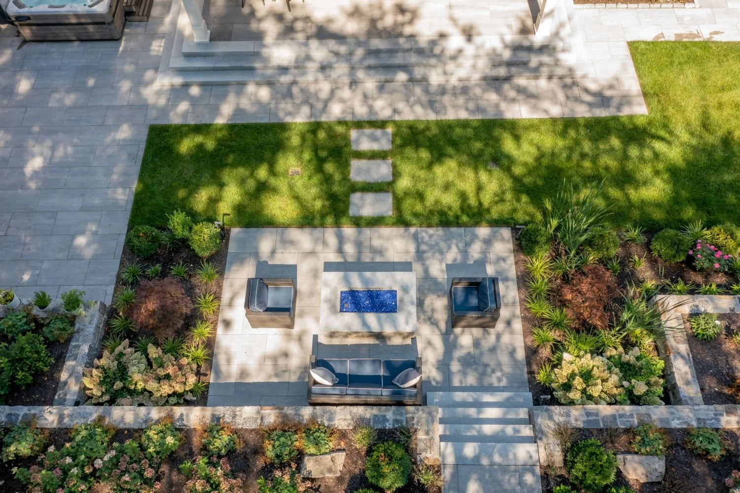 Fire pit lounge with patio pavers and seating area in Arlington, MA