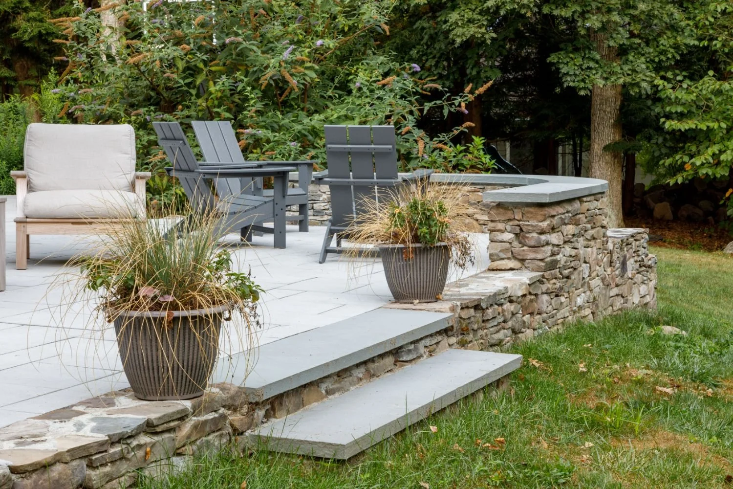A Beautiful Backyard Featuring Bluestone Patio and Curved Seat Wall in Arlington, MA