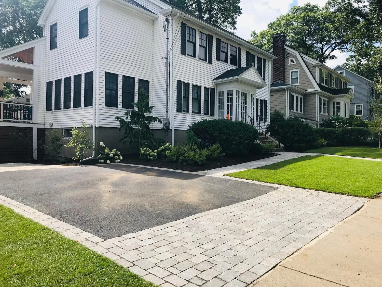 Driveway entrance finished with driveway pavers for curb appeal in Concord, MA