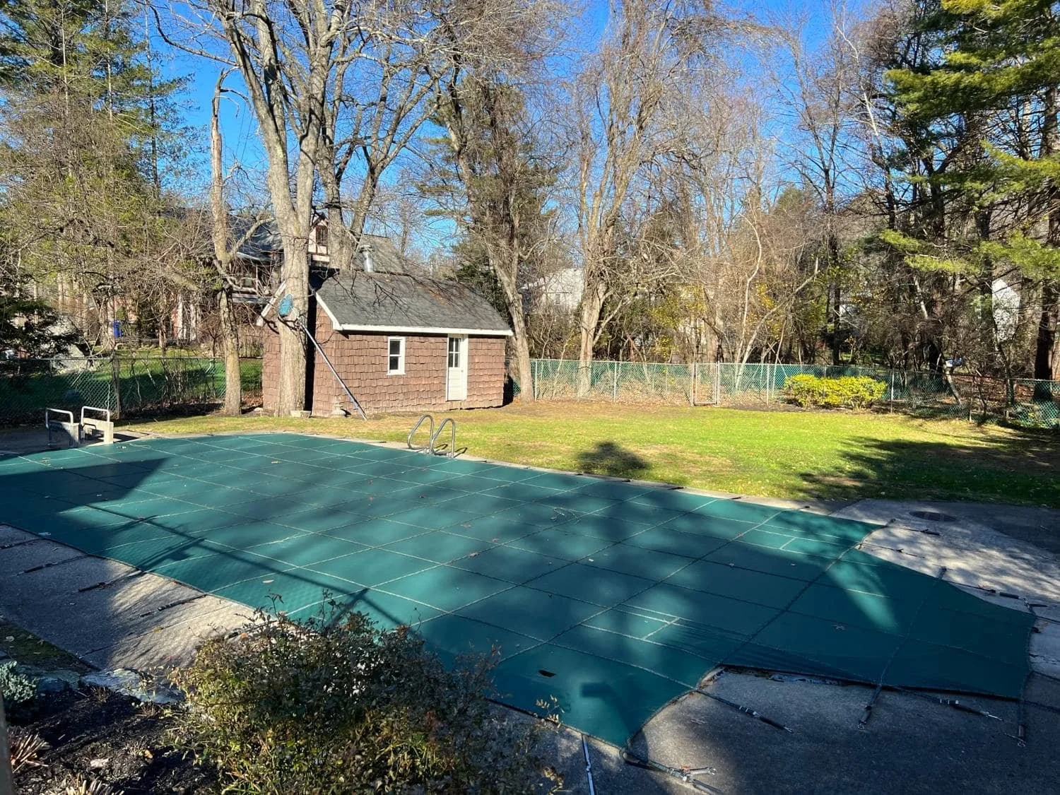 Custom Pool Deck and Raised Patio With Covered Structure in Sudbury, MA