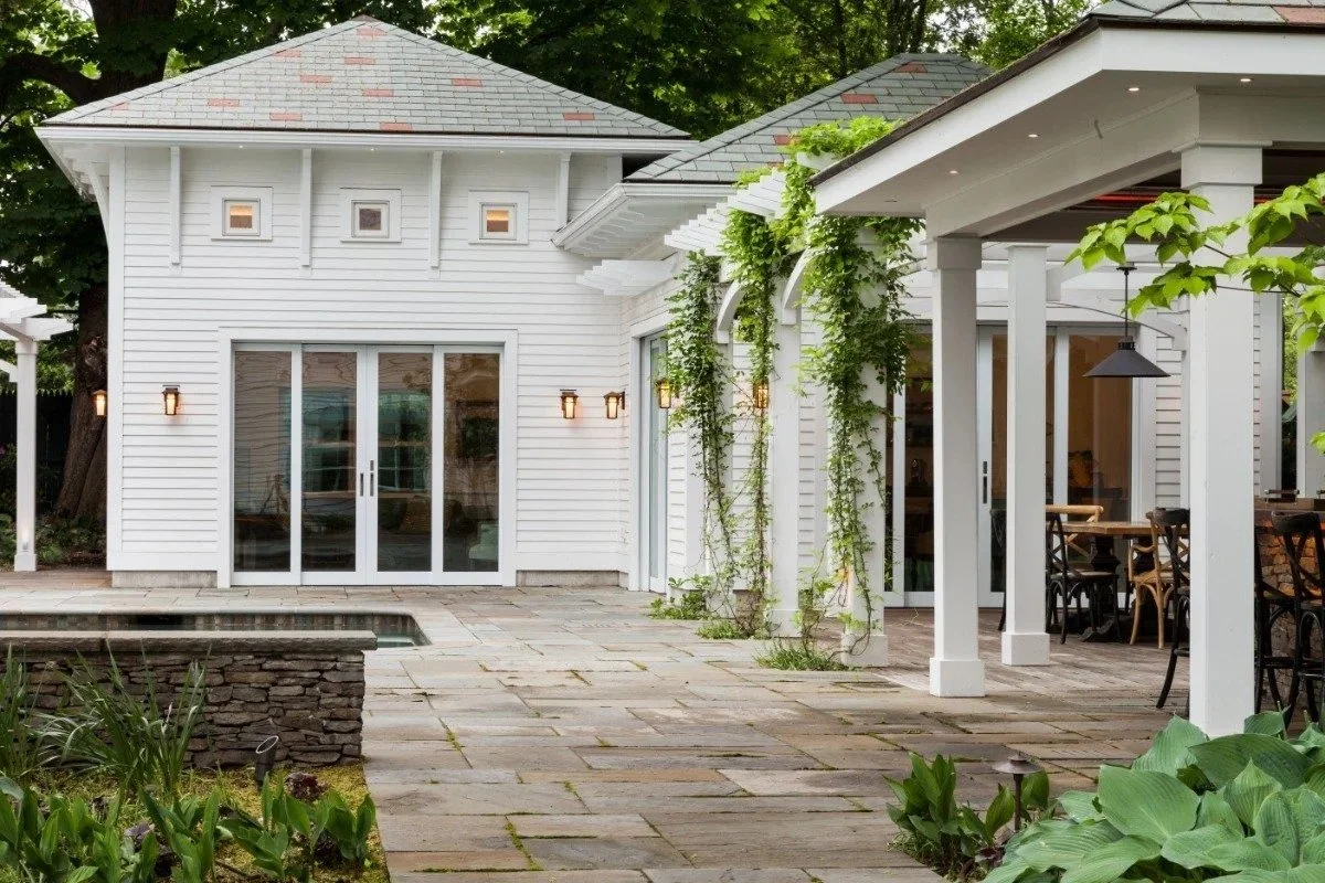 Outdoor kitchen pavilion with stone bar and pergola in Cambridge, MA landscape design