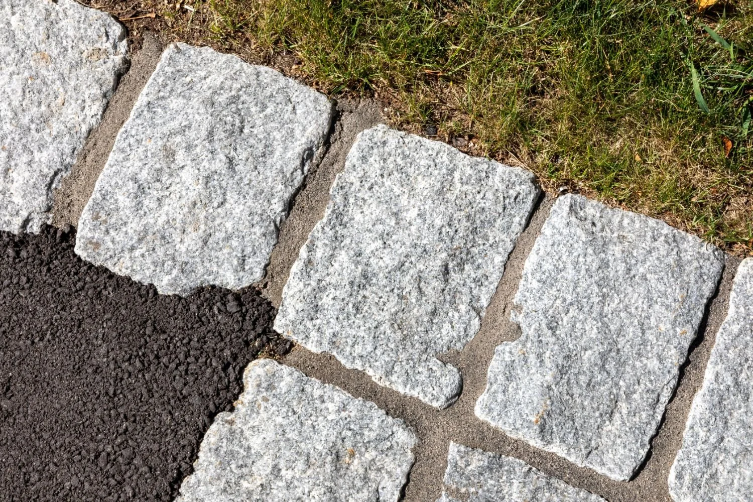 Close-up detail of natural stone patio pavers in Arlington, MA