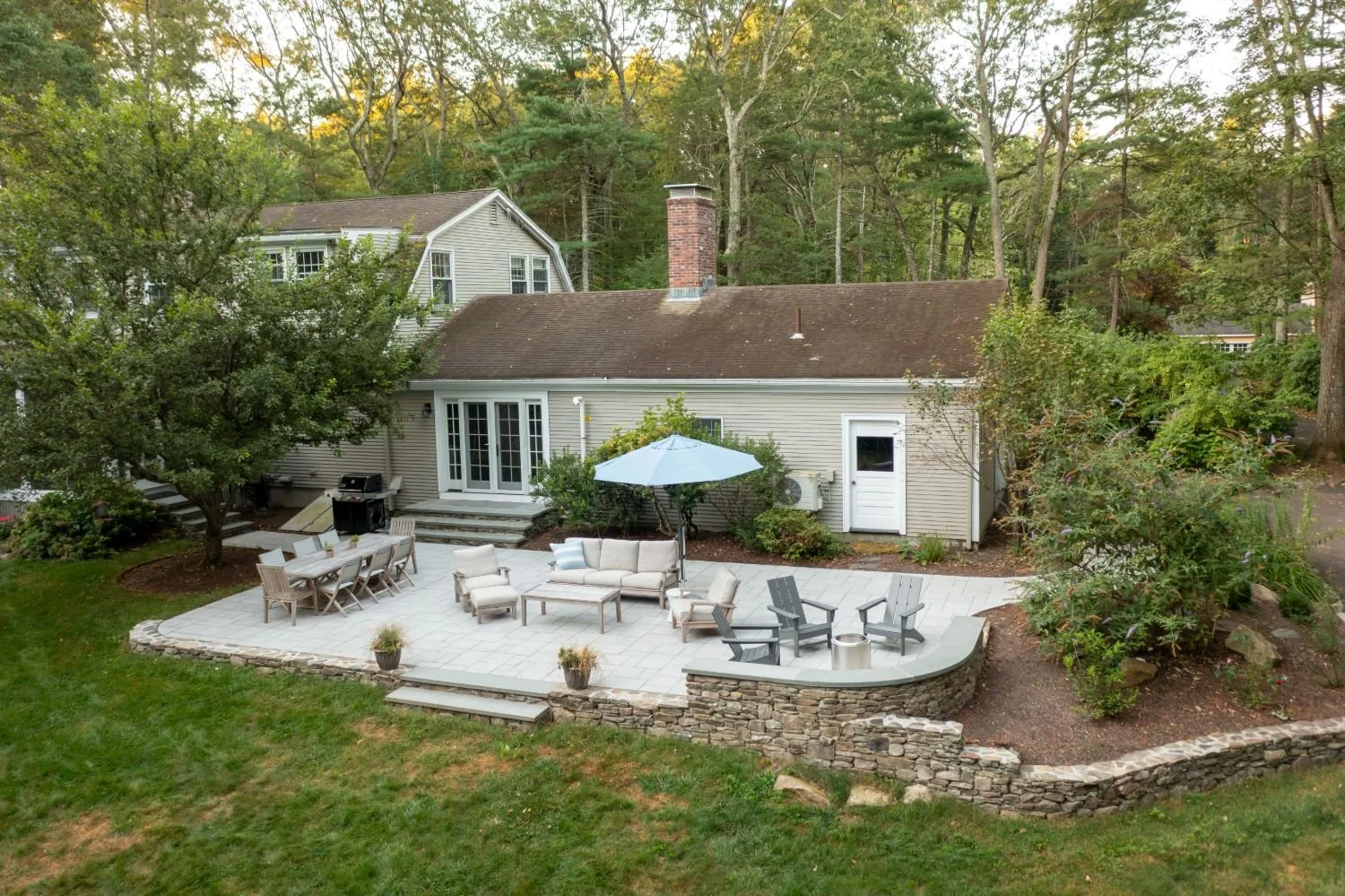 Backyard patio transformation with expanded entertaining space in Lexington, MA
