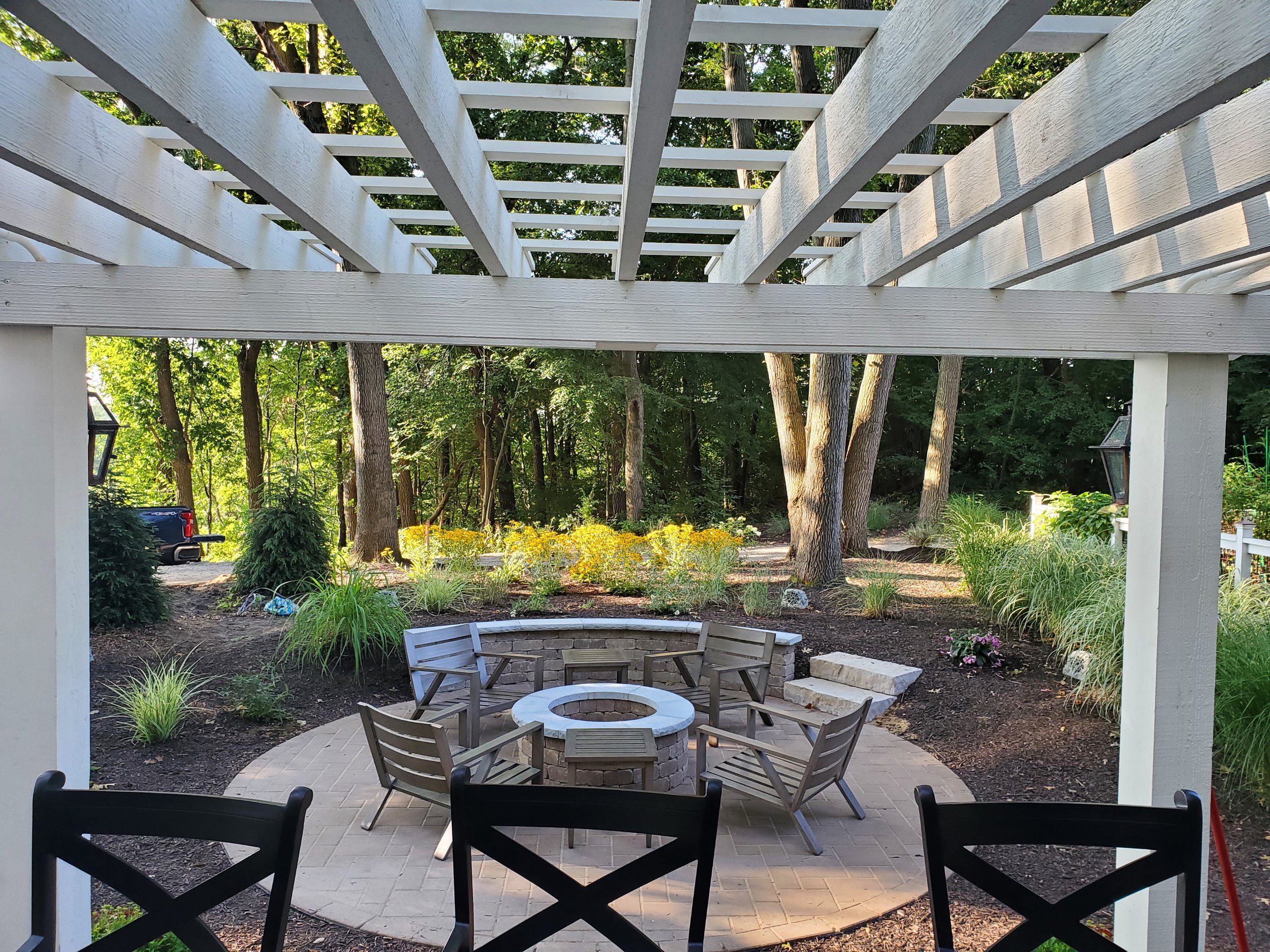 Custom stone fire pit with built-in seating in Southwest Michigan