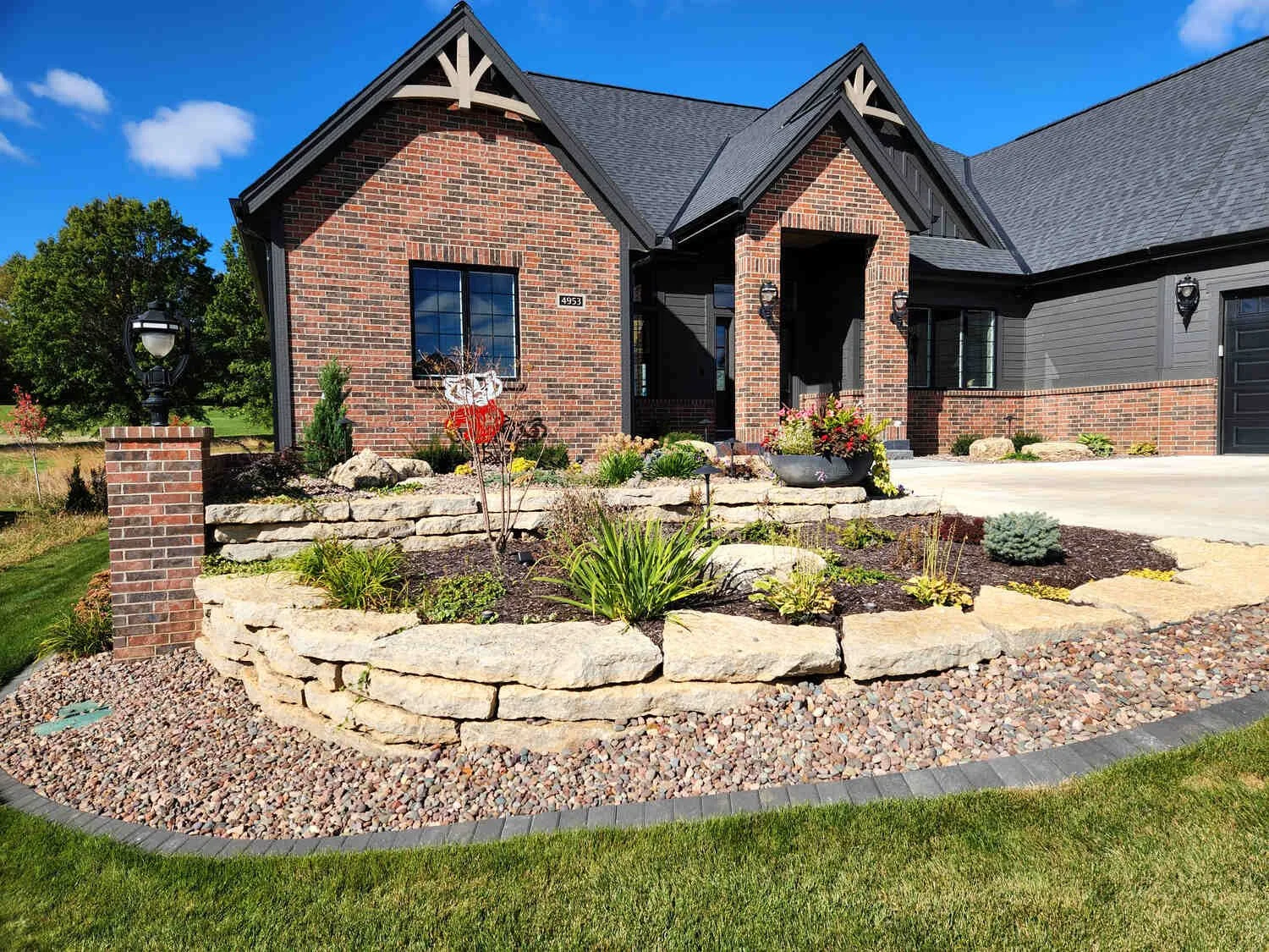 Foundation planting with evergreen shrubs and mulch in Madison, WI