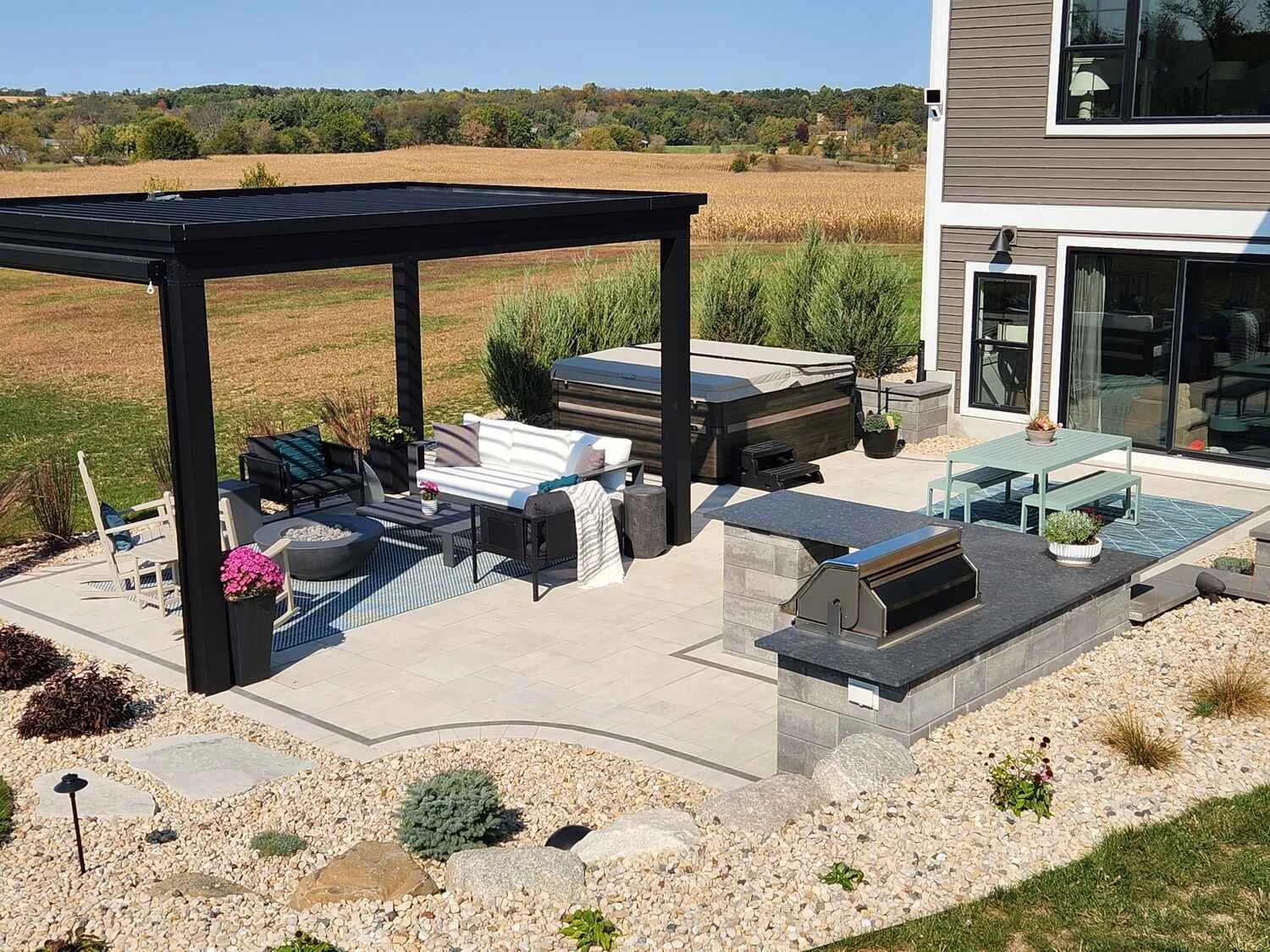 Built-in grill and bar seating in outdoor kitchen in Waunakee, WI