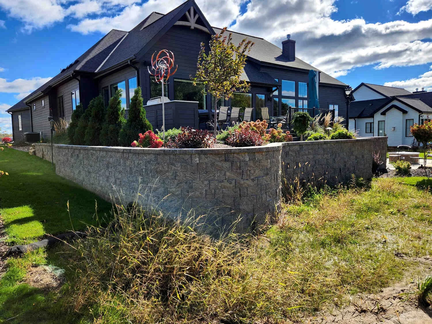 Backyard landscape design with wide planting borders in Madison, WI