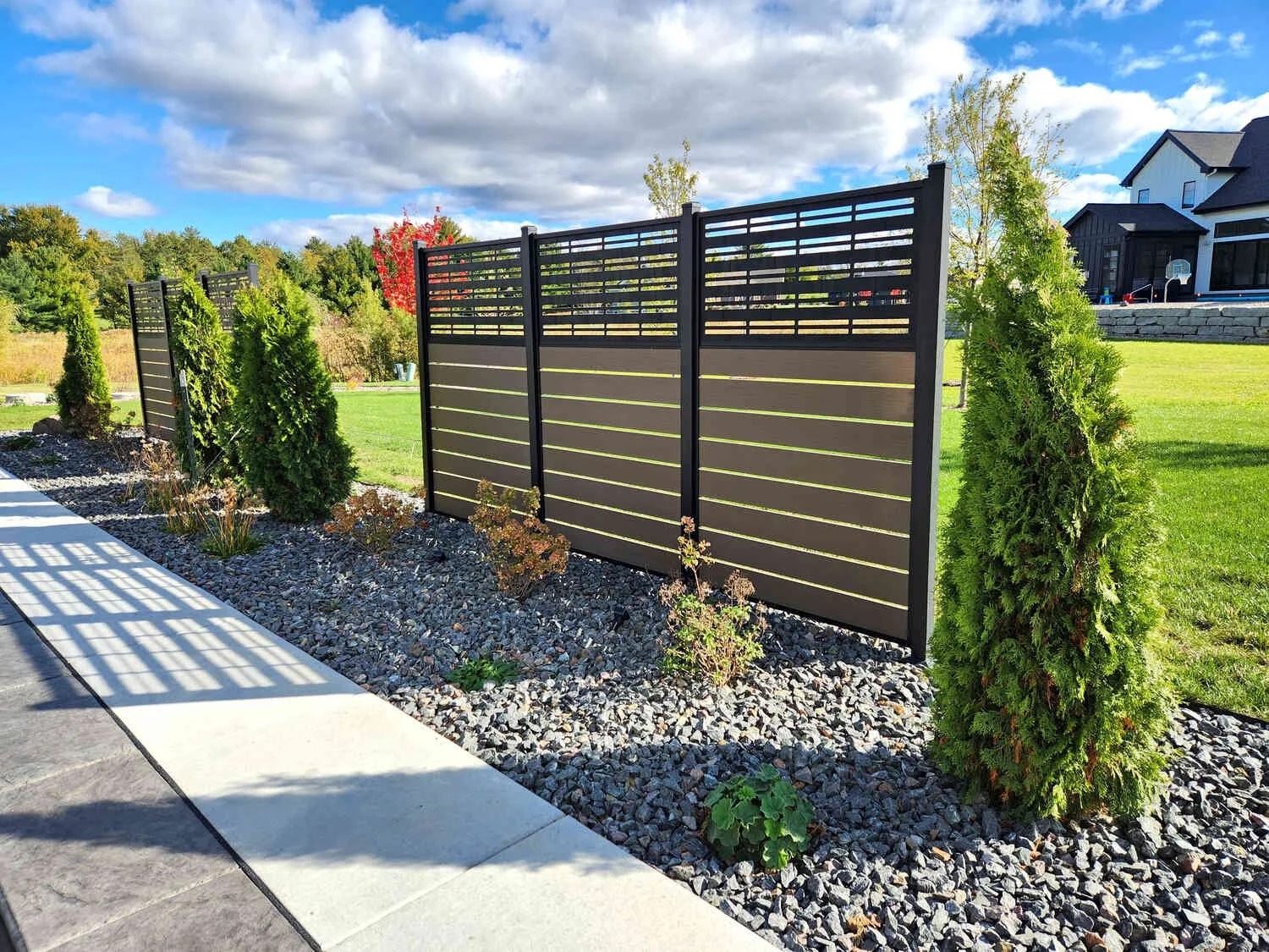 Side yard planting bed with gravel pathway in Sun Prairie, WI