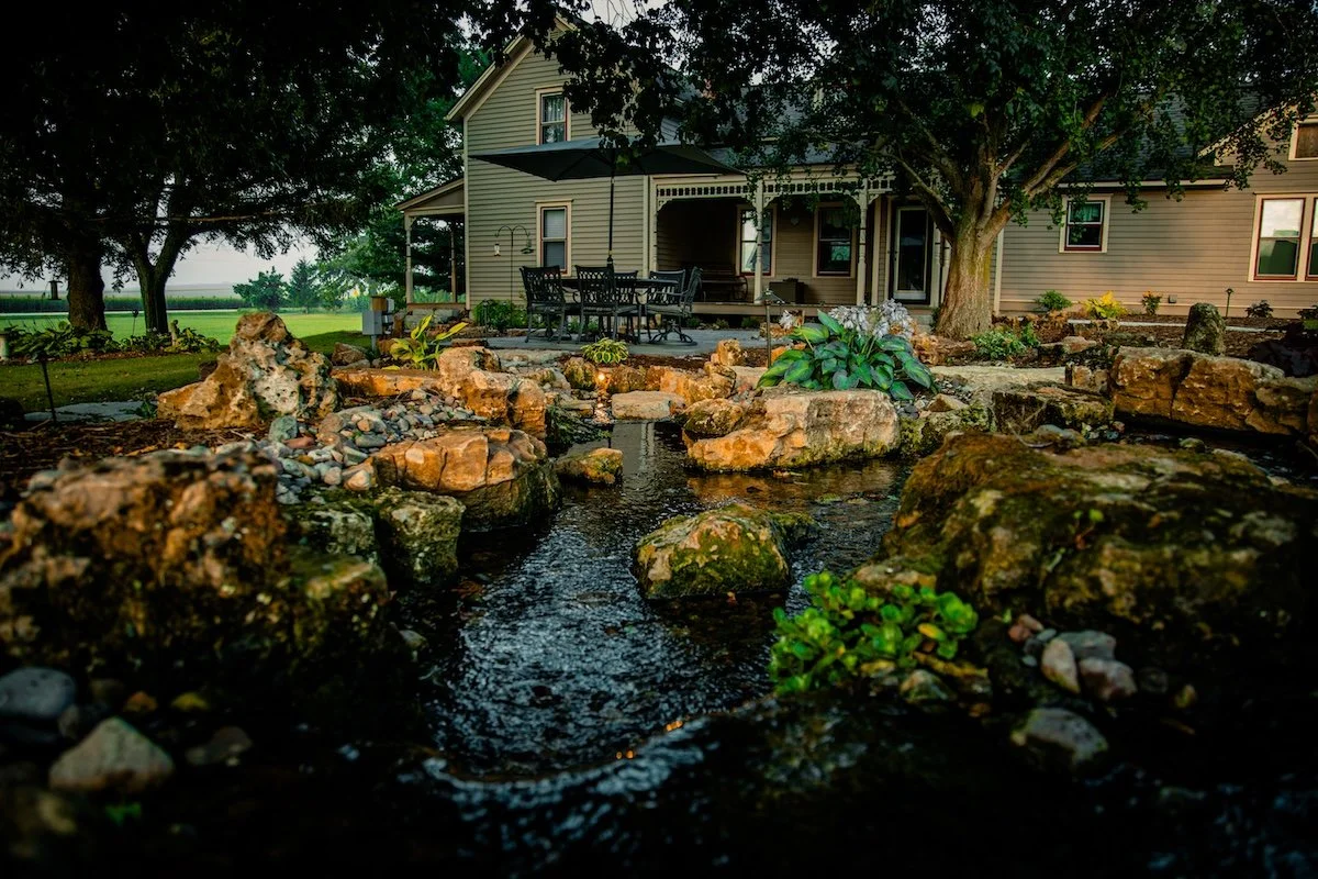 Cascading pondless waterfall with layered rocks in Middleton, WI