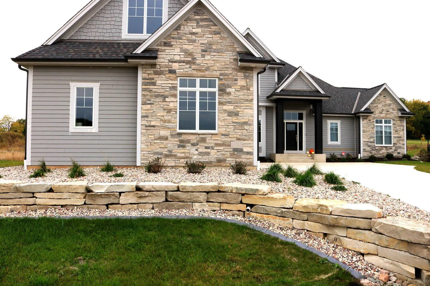 Decorative gravel mulch and low-maintenance flowers in Verona, WI