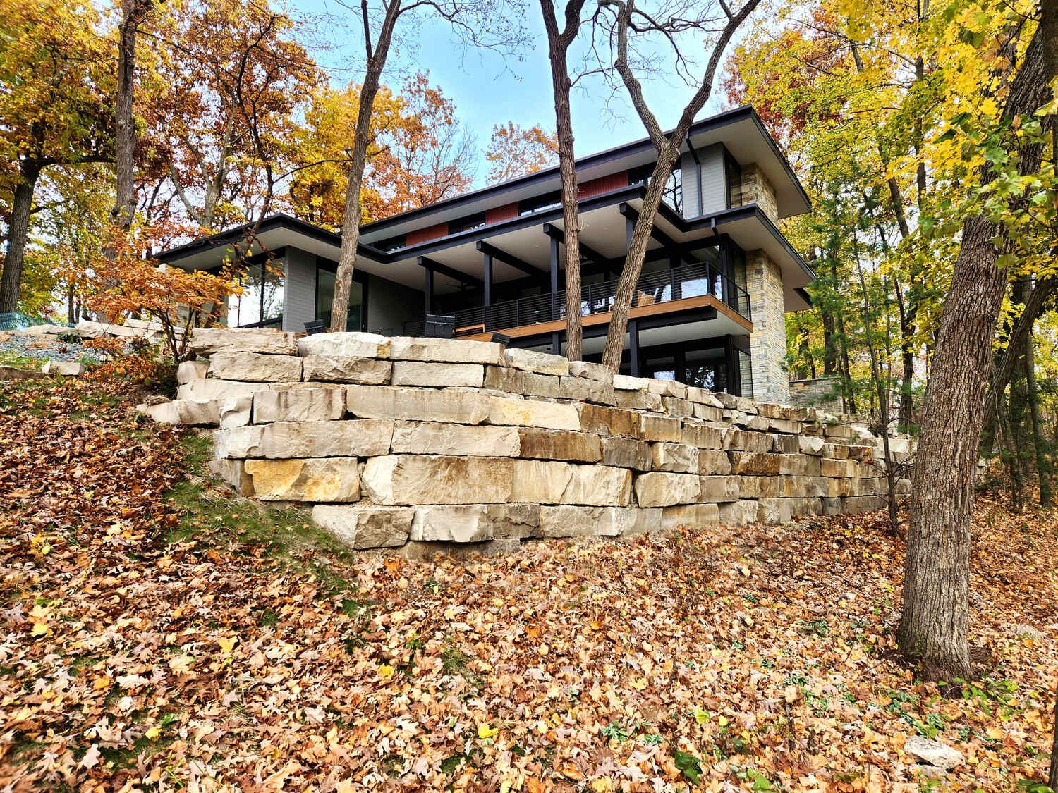 Hillside landscape transformation with natural materials in Madison, WI