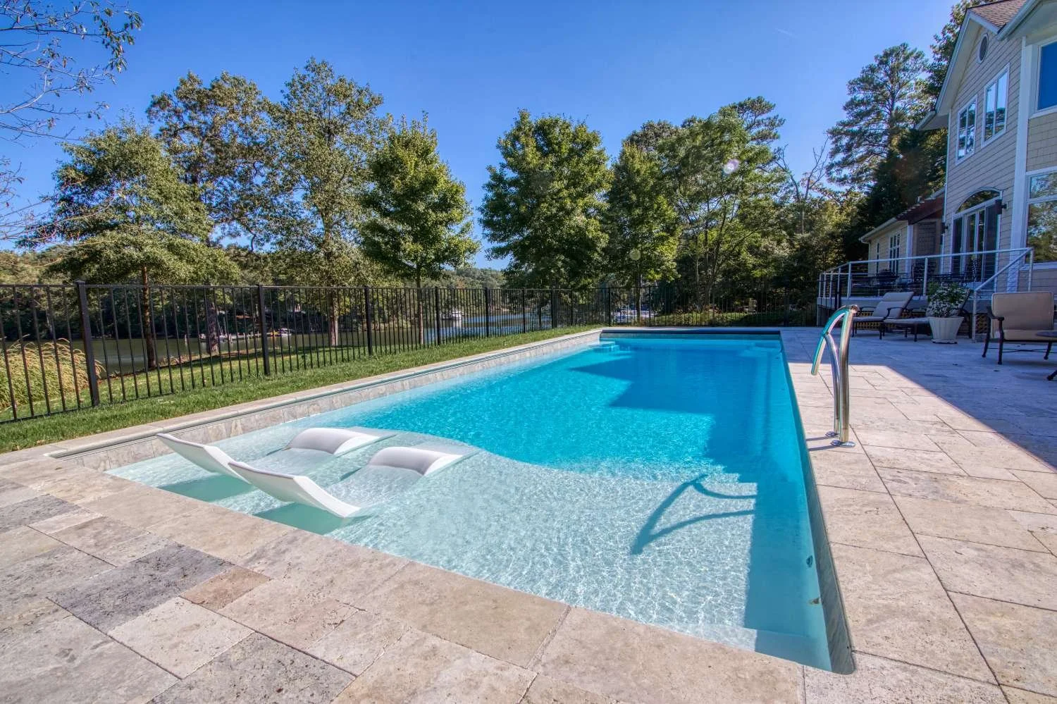 Low maintenance fiberglass pool with smooth waterline finish in Middleton, WI