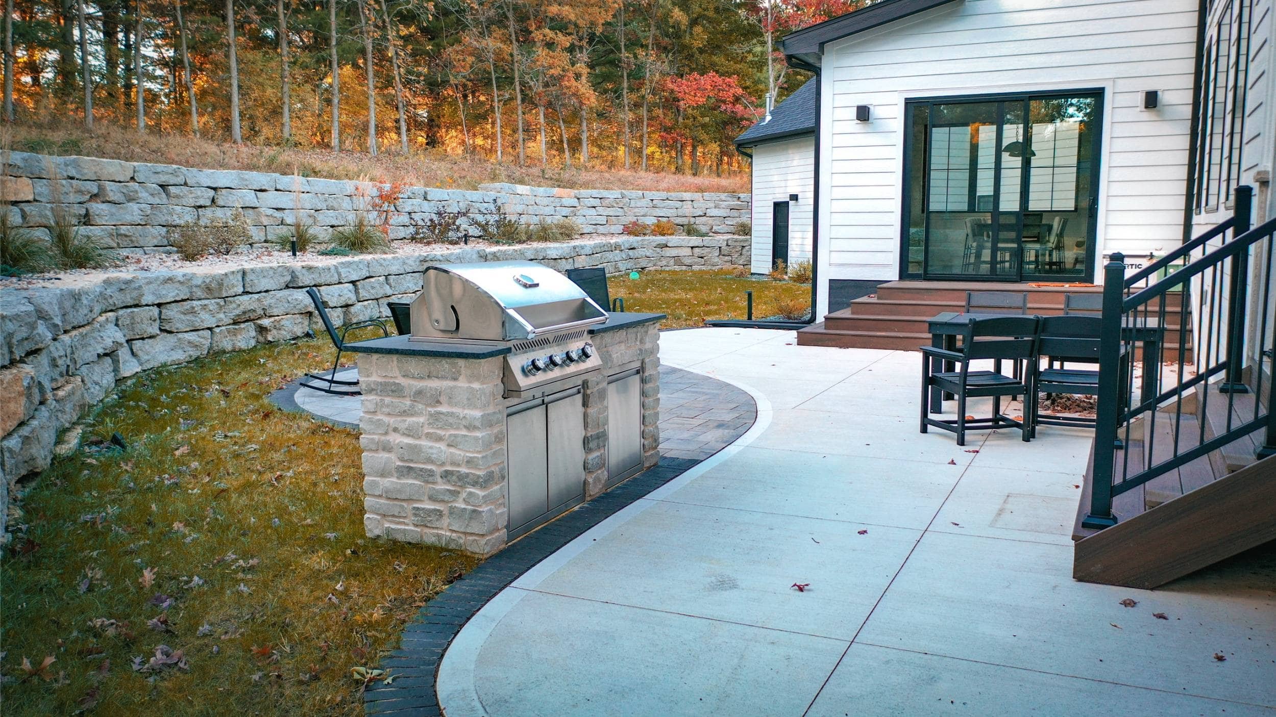 Backyard oasis featuring paver patio and outdoor kitchen in Sun Prairie, WI