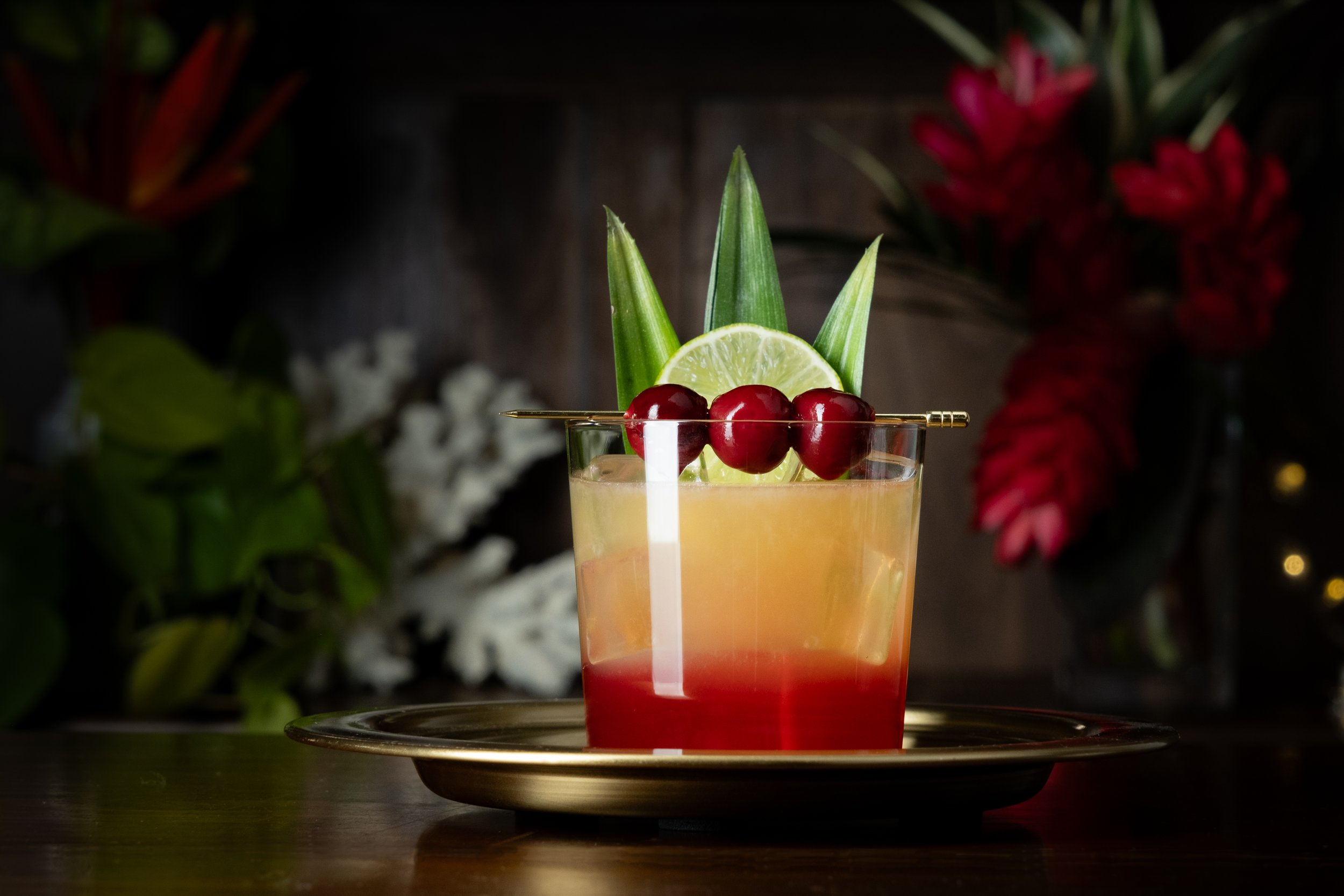 Mai Tai rum cocktail garnished with a dark Orasella tiki cocktail cherry.