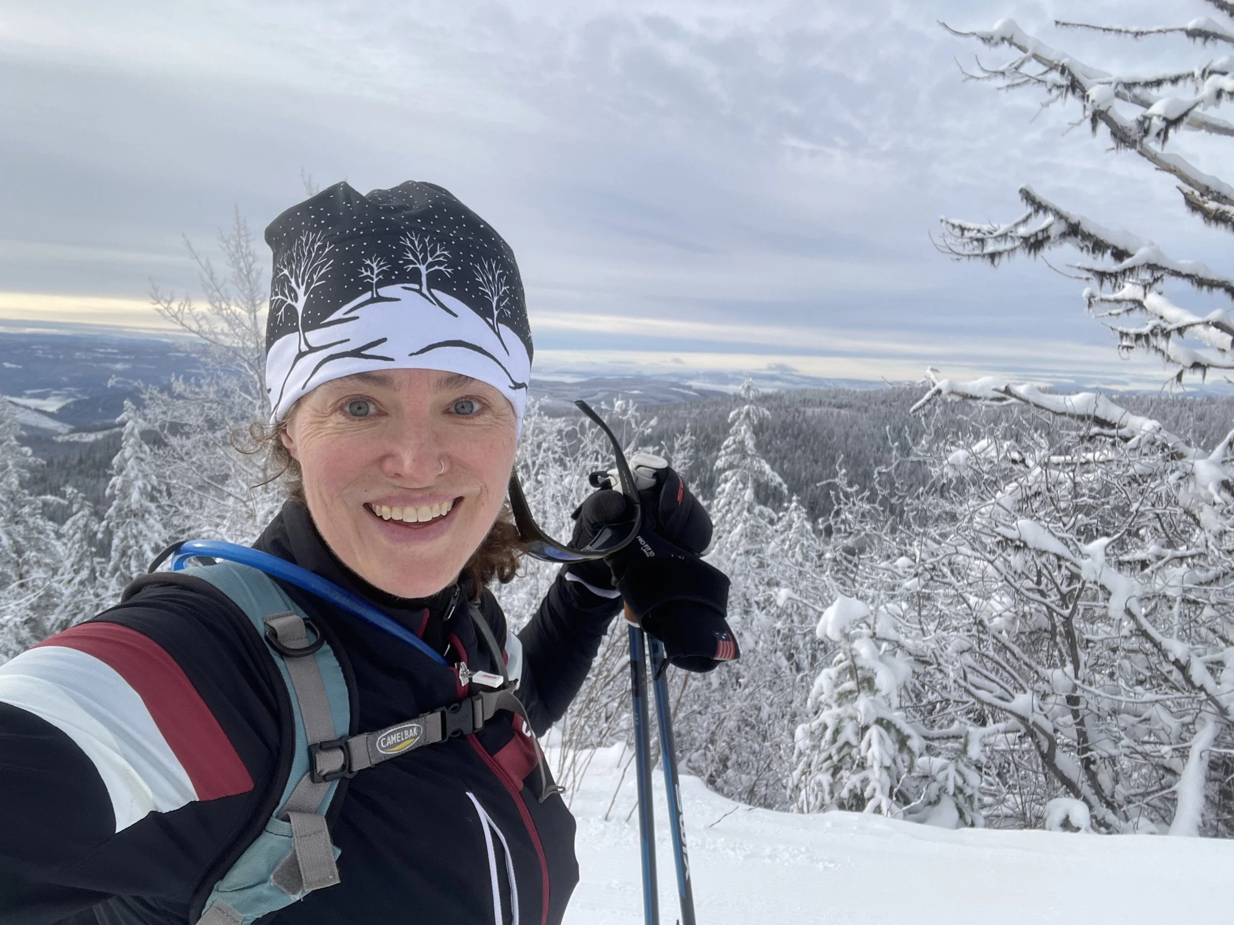 In this photo, Julanne Simpson is taking a break at the top of a climb when out cross country skate skiing.