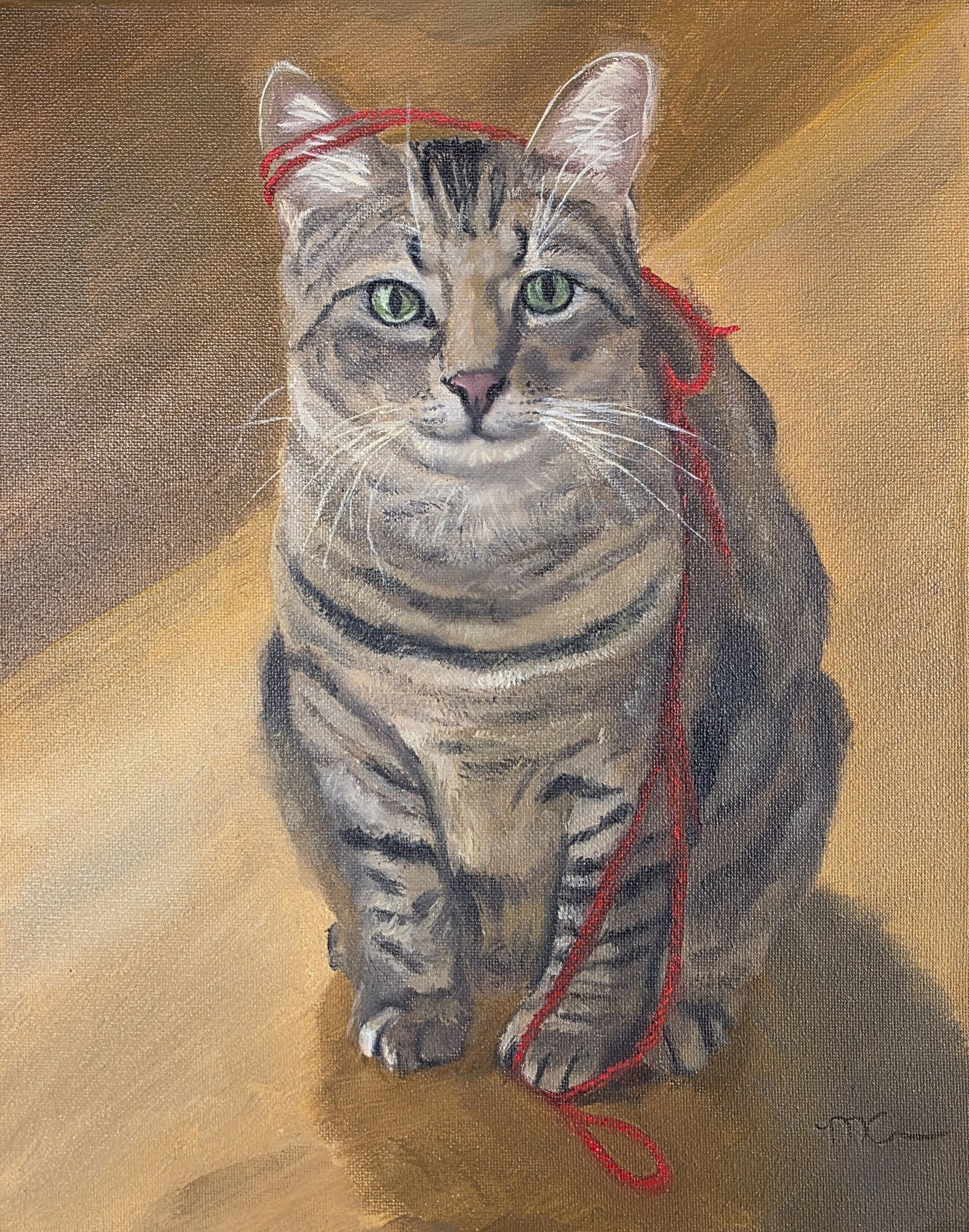 Painting of a tabby cat with green eyes and a pink nose, sitting on a yellow surface with a gradient background. The cat has a piece of red yarn draped over its head and neck.