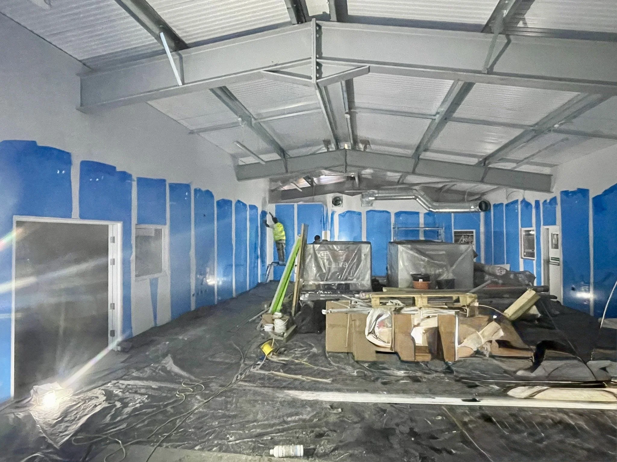 Installation of moisture and heat resistant wall cladding, at Faversham Linen Services in Kent, installed by Cladify.