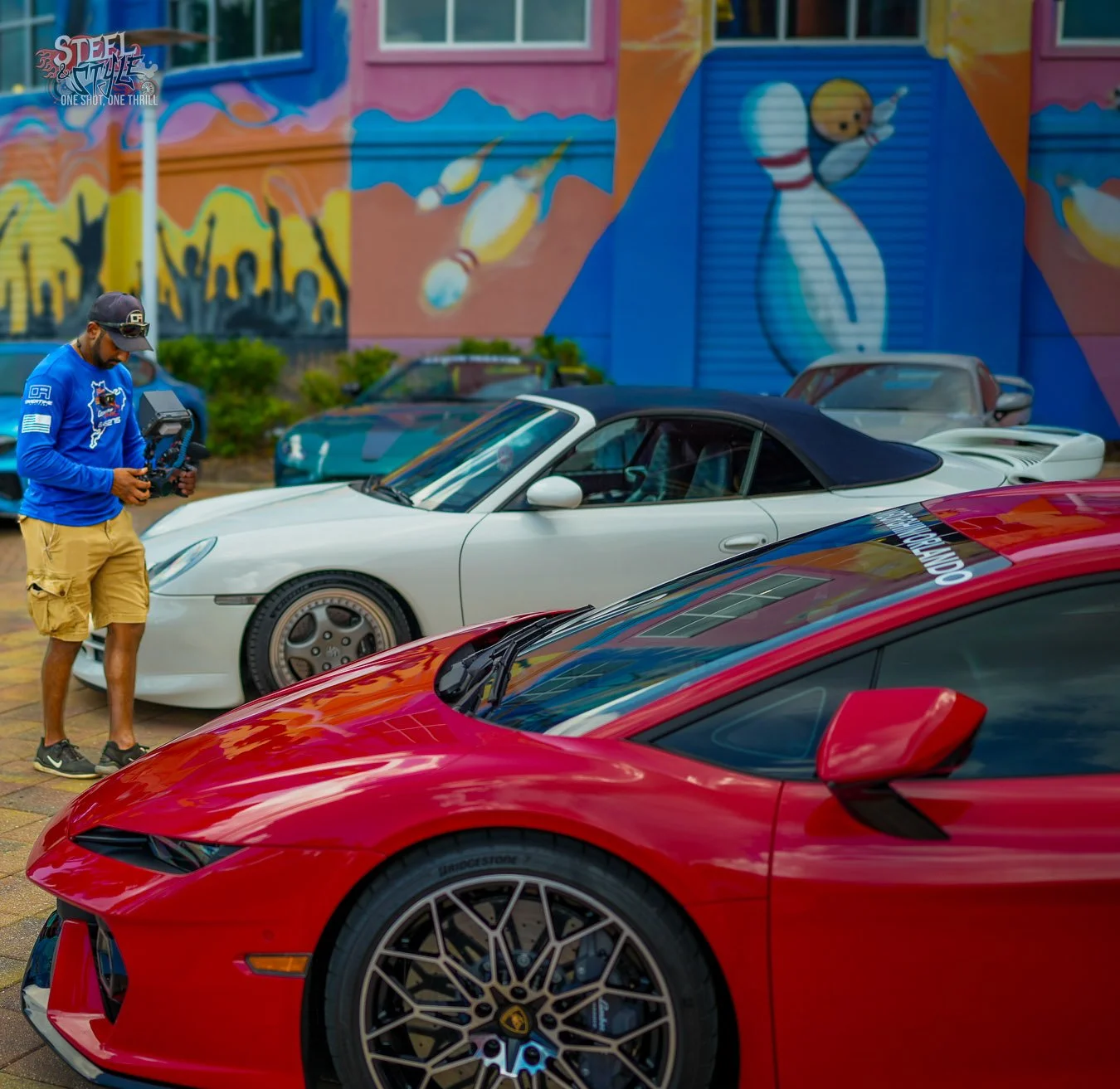 Overtime Attitude photographing a red Lamborghini Huracán and a white Porsche 911 Cabriolet during the Velocity Rally at Dezerland Park in Orlando.