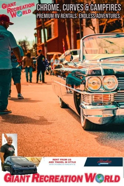 Vintage car parked on a street during a recreation event with people walking nearby in a small town setting.