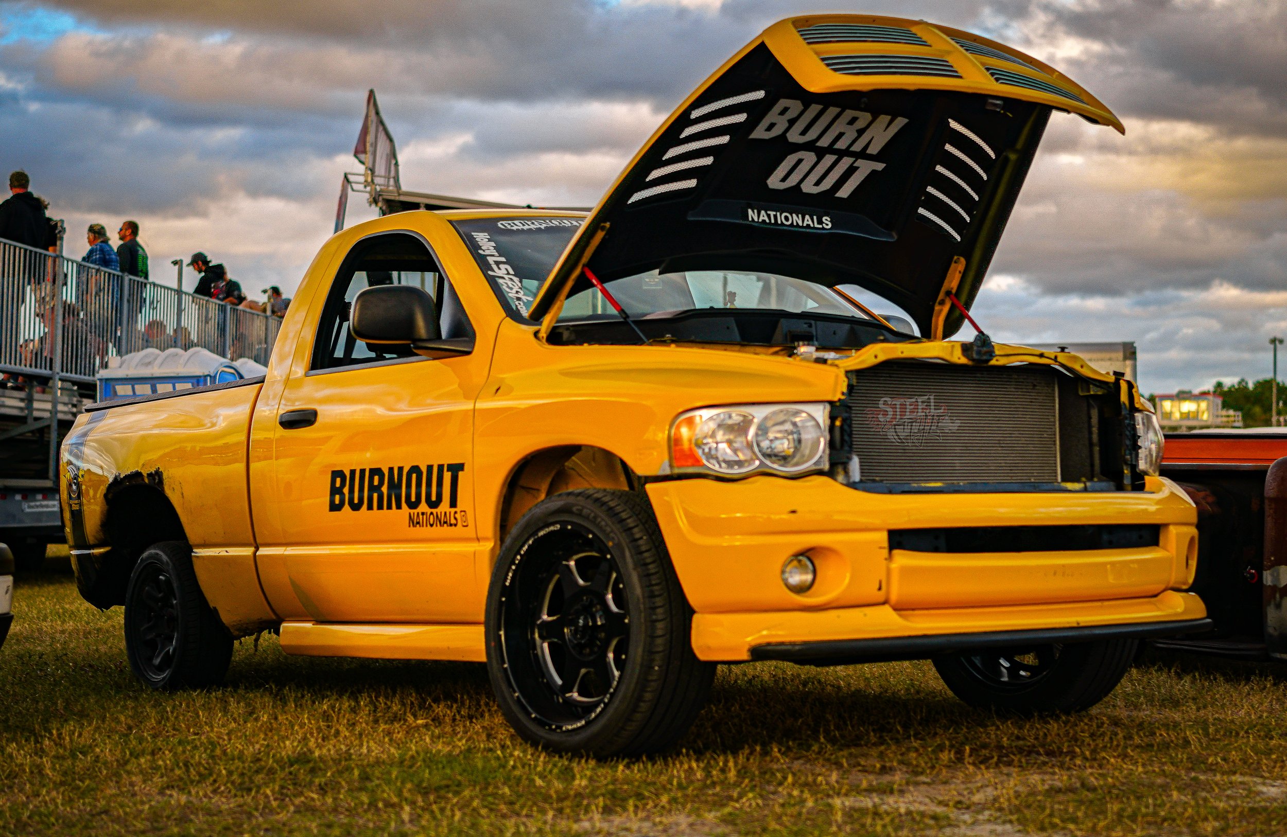 Yellow pickup truck with racing modifications and 