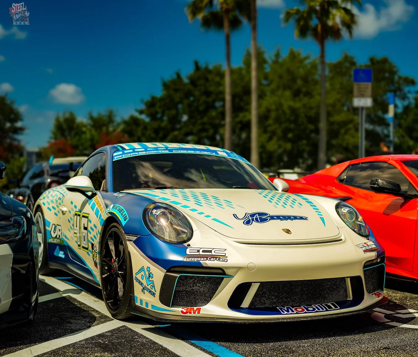 Blue and white Porsche on display during The Hamilton Collection.