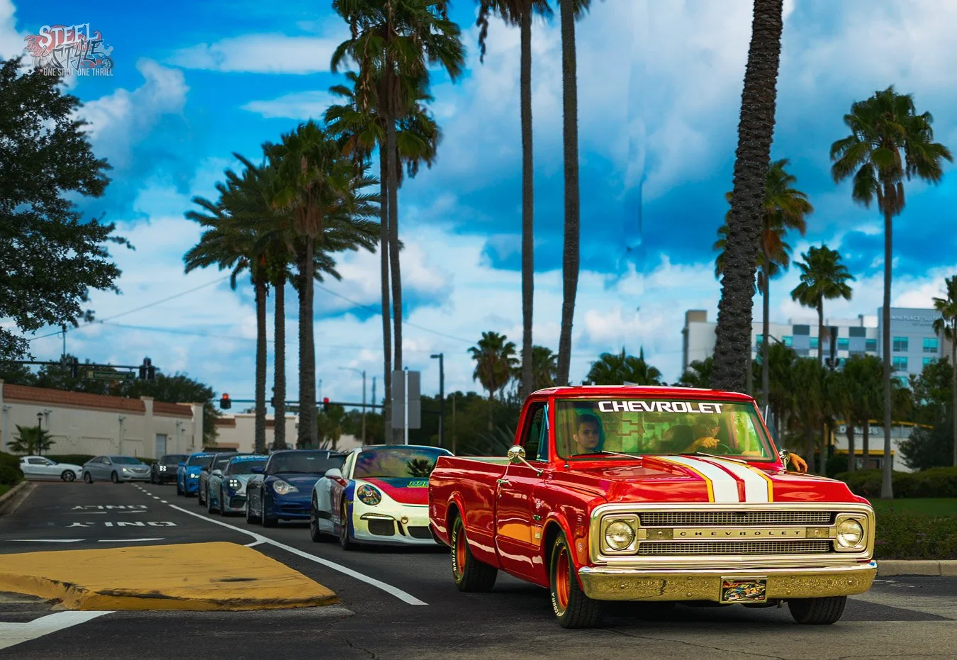 Custom artwork of colorful Chevrolet Corvettes lined up outside a retro beachside drive-in diner at sunset with palm trees and neon lights.