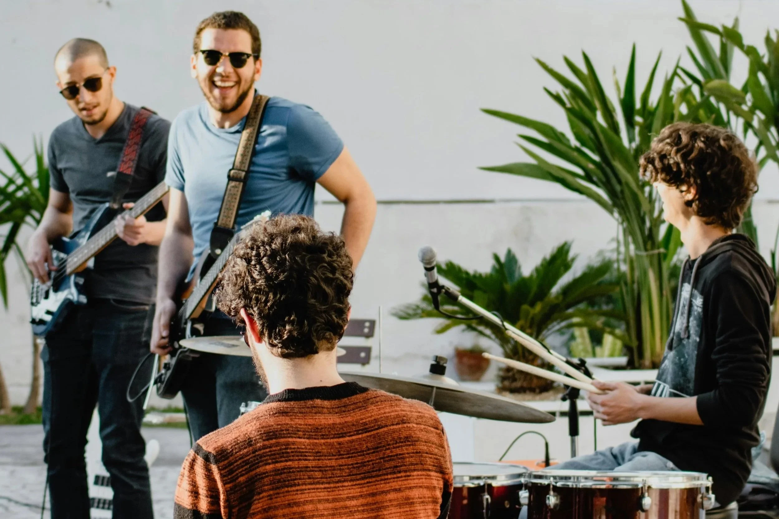 4 musicians laughing together