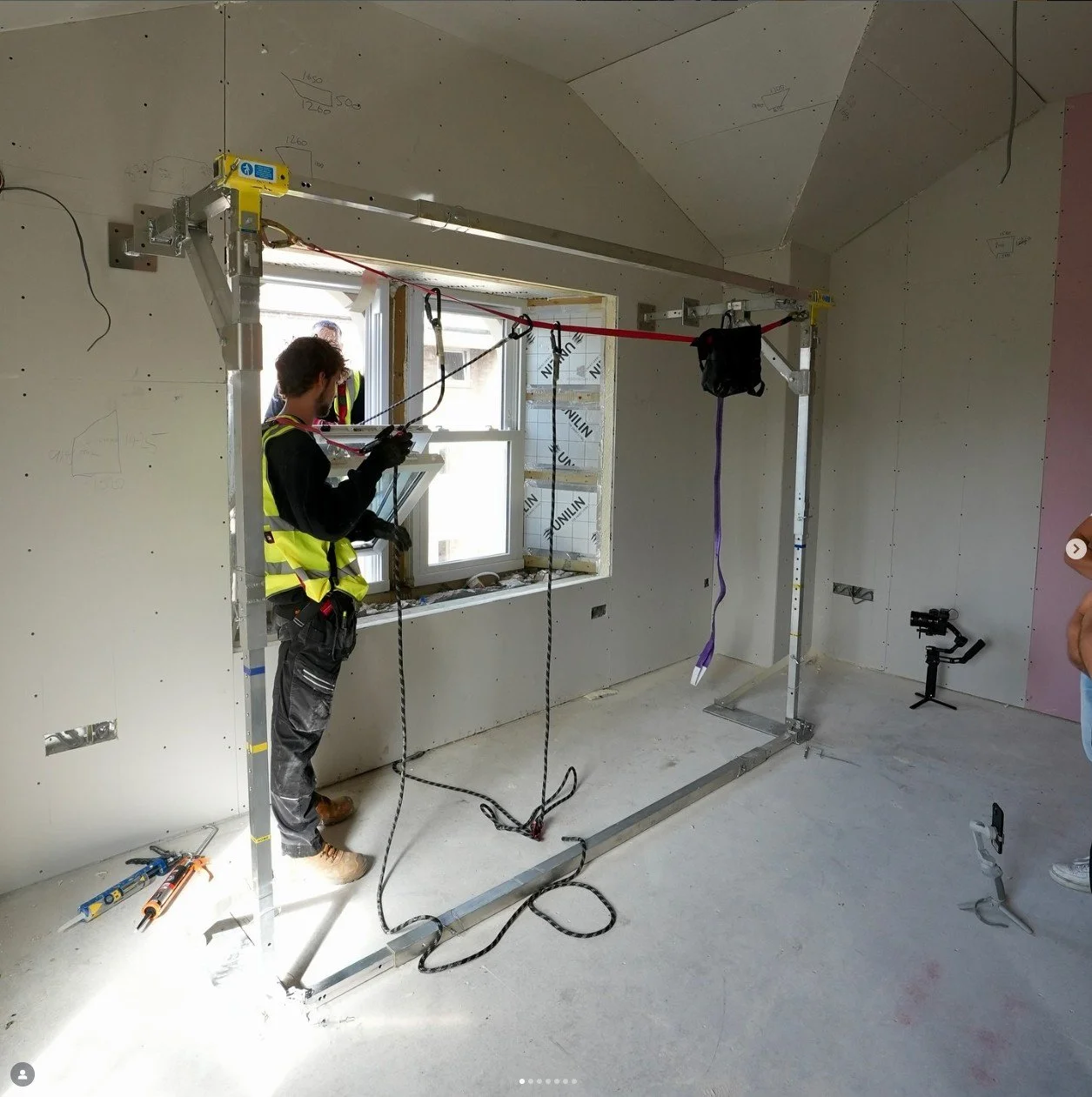 window-installers-working-from-inside-building