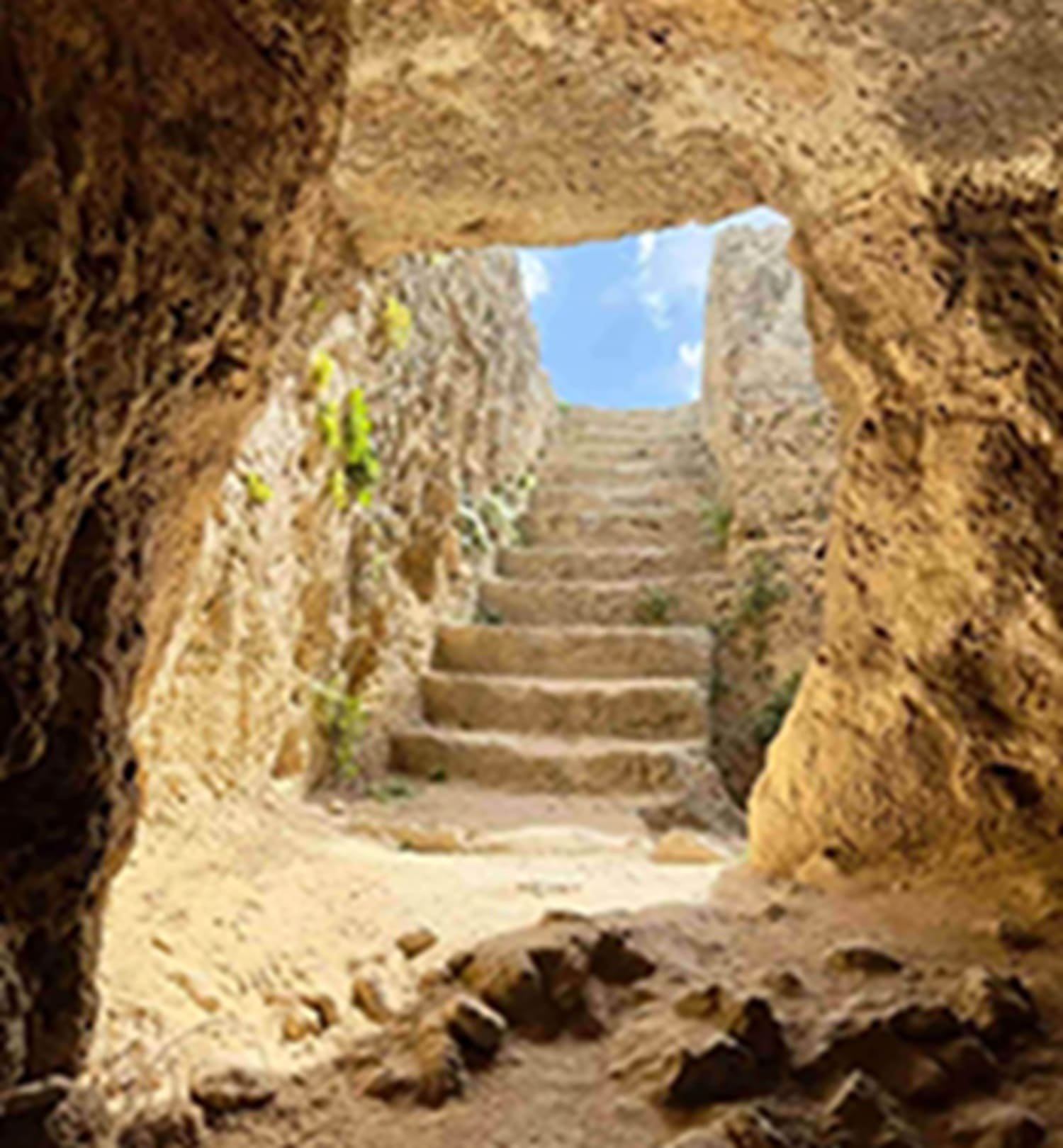 Stone steps leading out of cave into sunshine. 