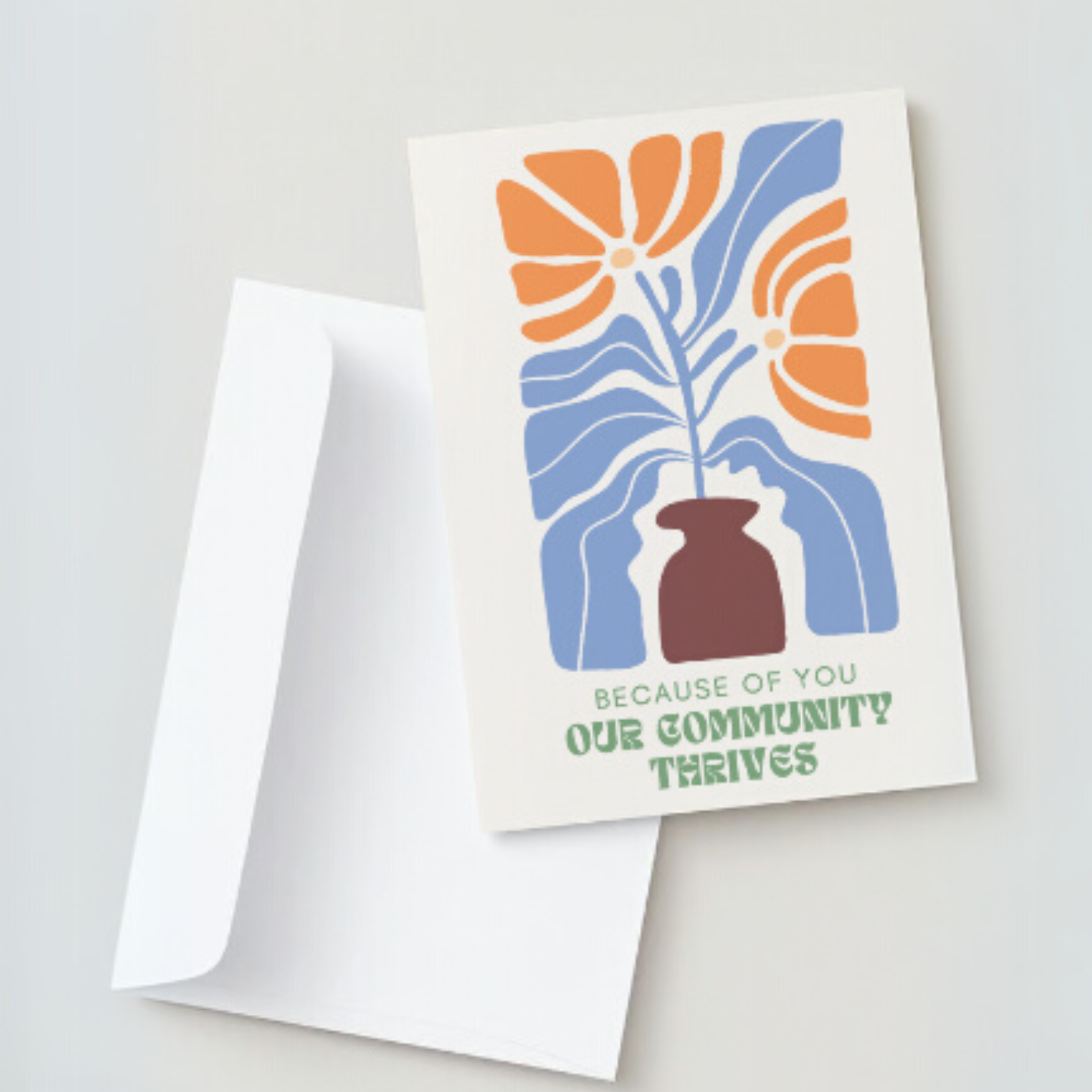 Greeting card syaing "Because of you, our community thrives" with a beautifully designed flower