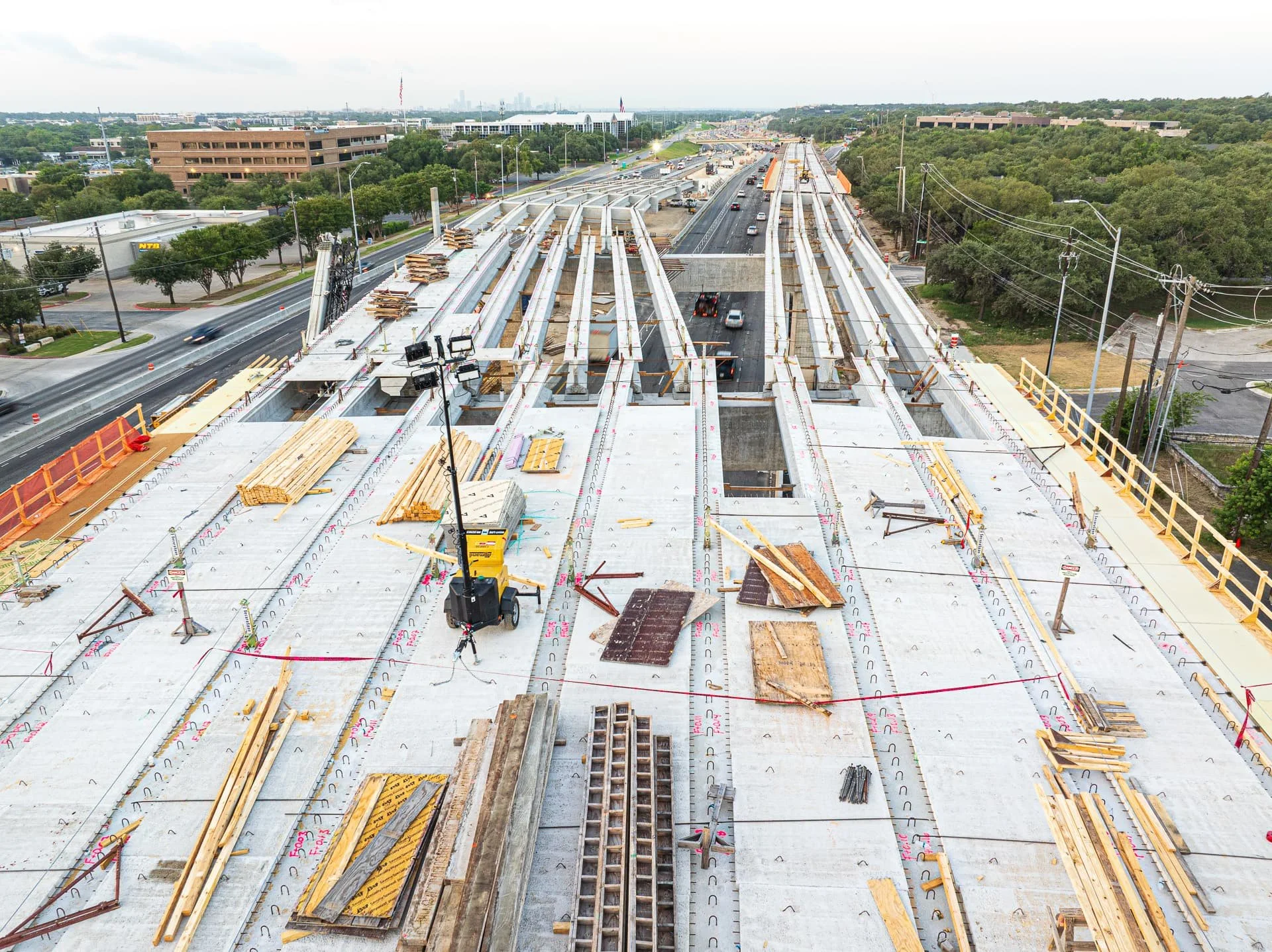 Precast bridge construction on MoPac tollway in Austin, Texas, showing beams and elevated roadway progress.