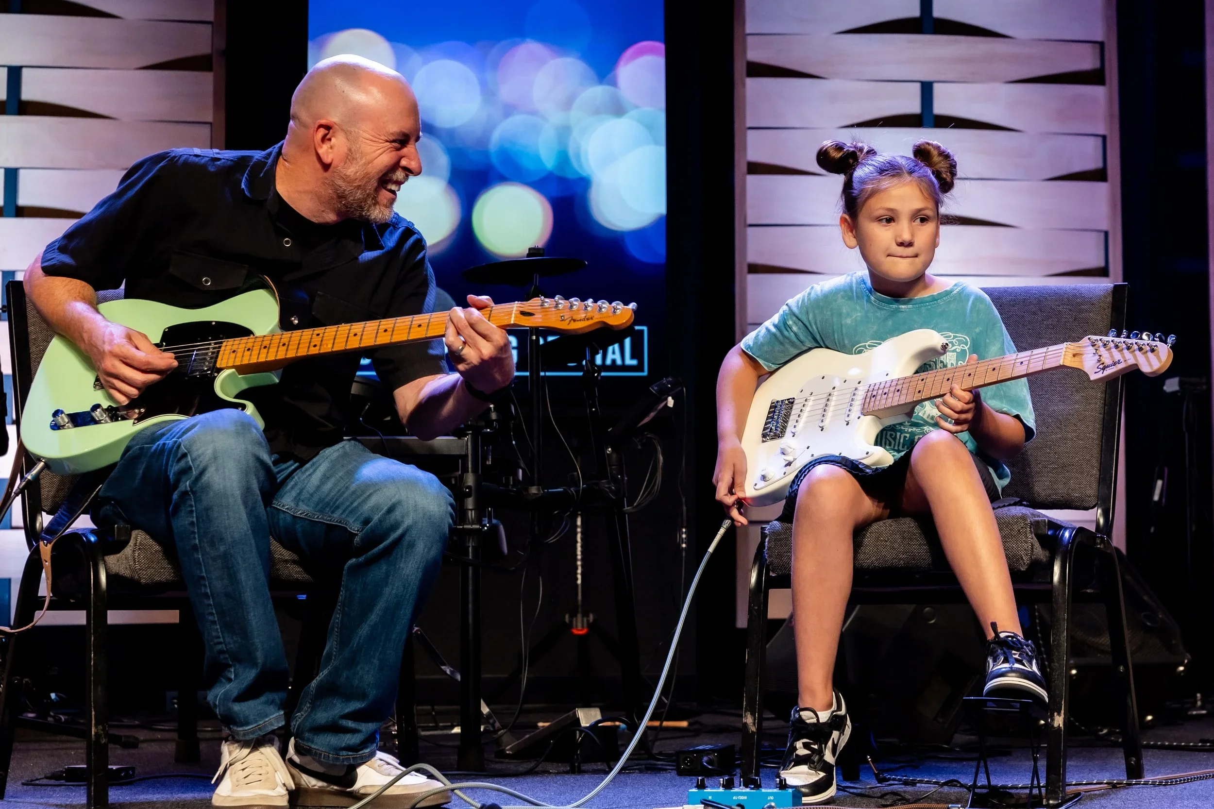 Steve teaches guitar at the Wylie School of Music. Pictured here with an electric guitar.