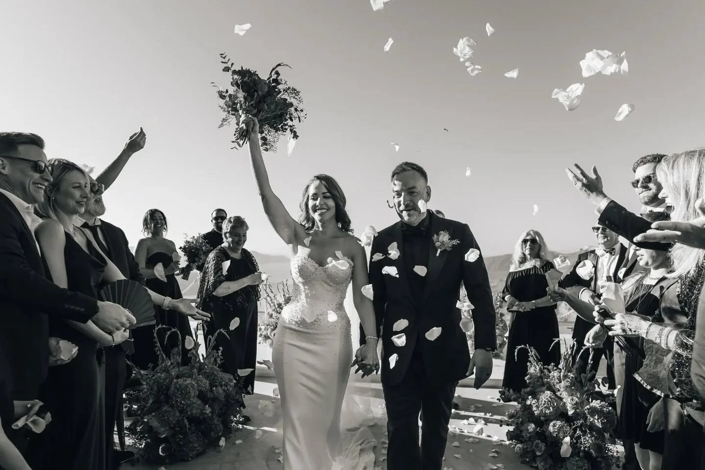 The moment &quot;I do&quot; becomes &quot;we did&quot;! ✨

Petals in the air, joy in the eyes and a forever that begins exactly as it should. 🥂

Venue: @santorini_gem 
Photo - Video: @lifeclicks_studio 
Flowers: @shadesofflowers.santorini 
Signage -
