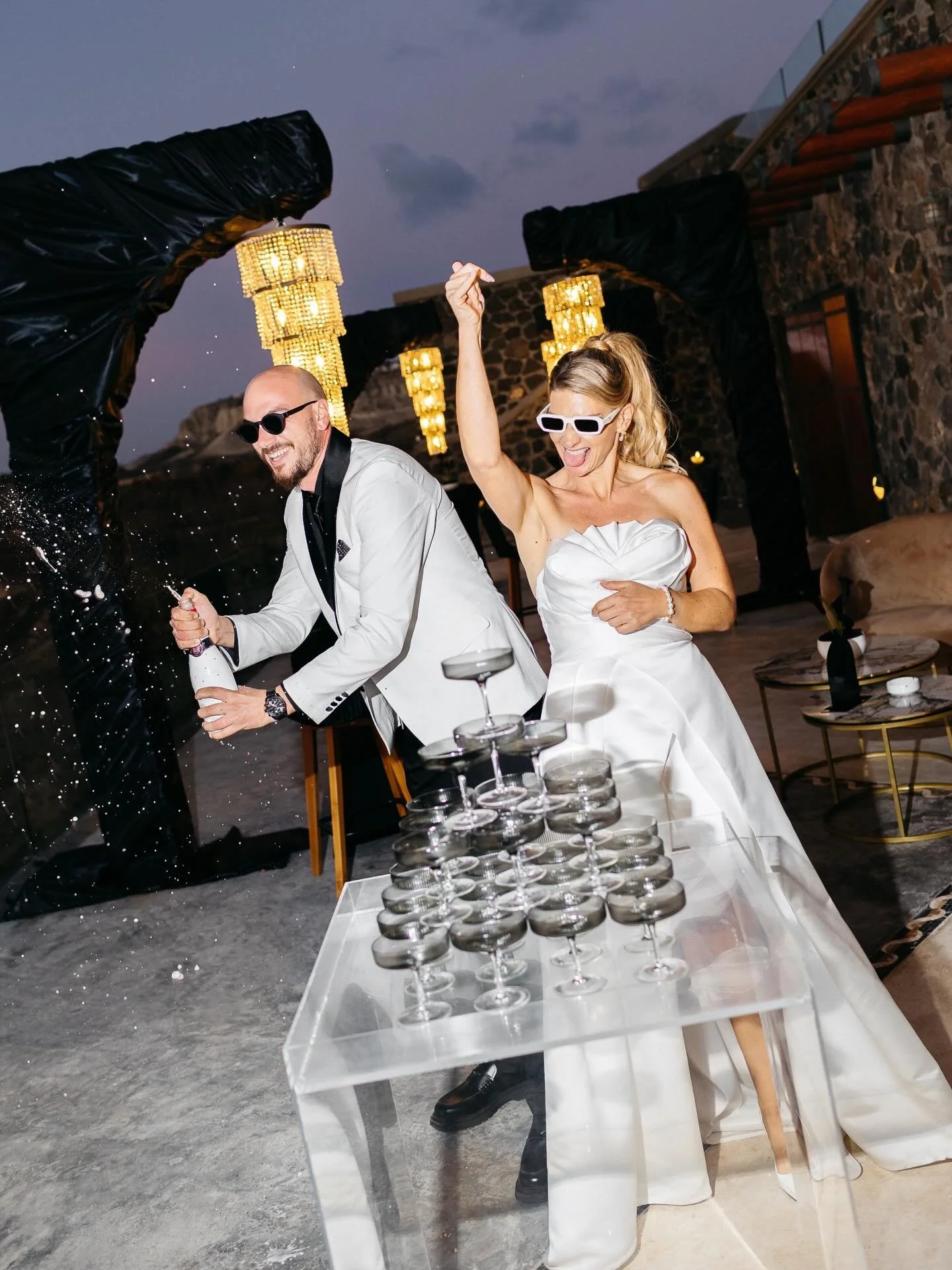 A little more from my own "I do": Crisp whites, bold blacks (yes, black can be there at a wedding), sparkling dancers and just the right amount (?) of champagne drama. All proof that weddings can be elegant and a little wild.

"It take