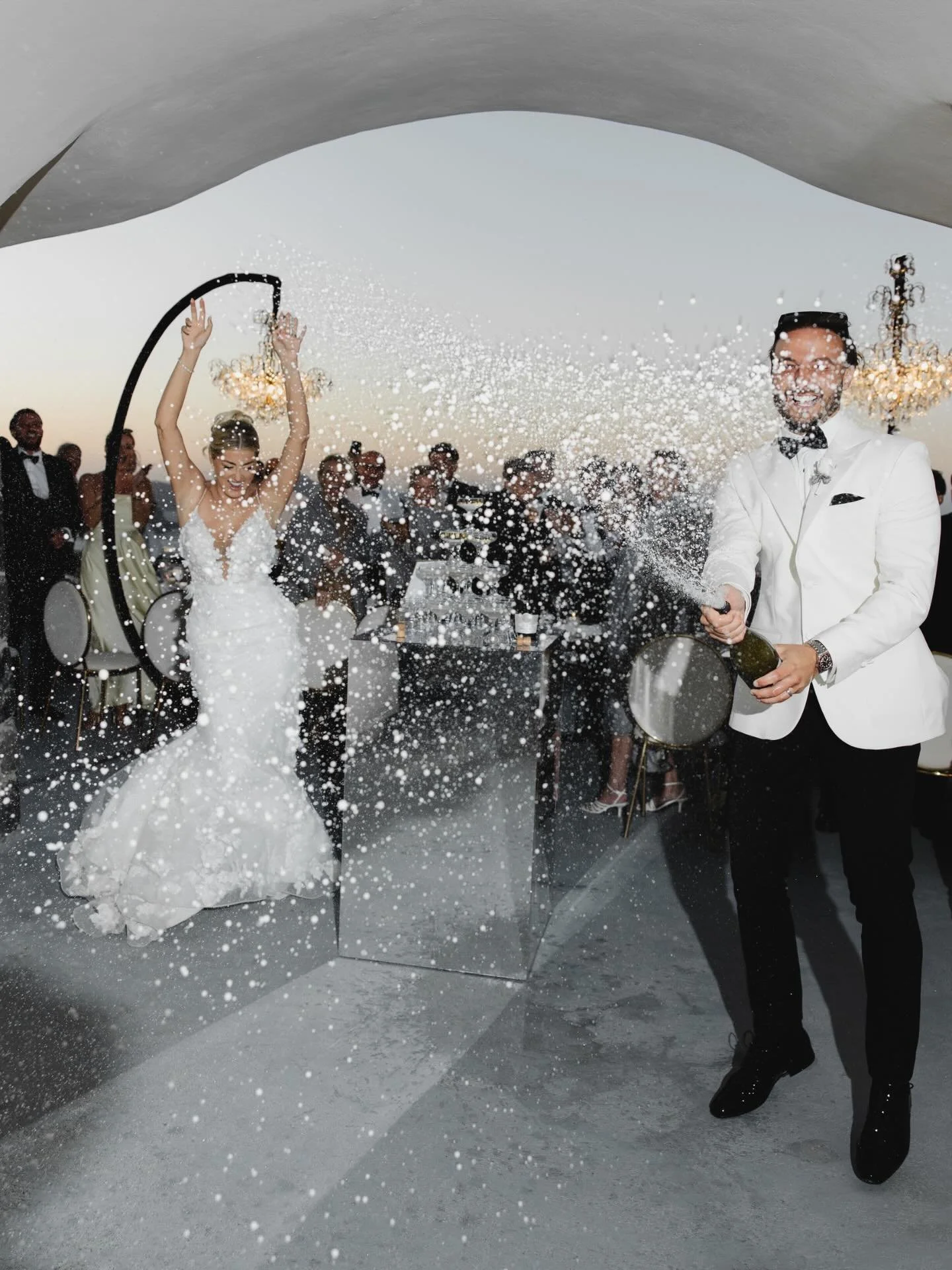 Lots of champagne, a lot of love and the perfect wedding glow. 🥂✨

Effortlessly stylish. Unapologetically joyful.

Venue: @elvientosantorini 
Photographer: @greecephotographer 
Videographer: @magic_videography 
Flowers: @shadesofflowers.santorini 
D